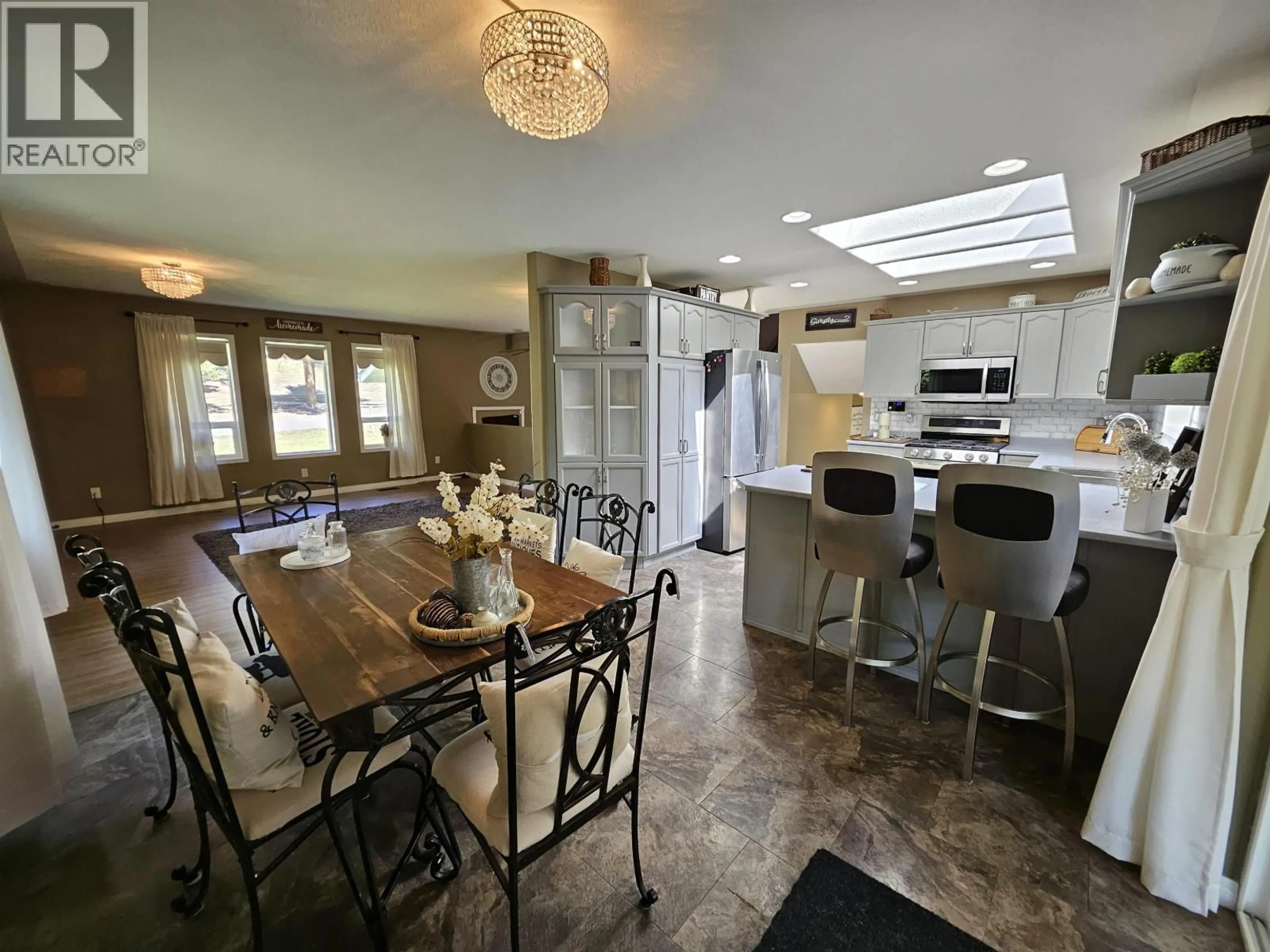 Open concept kitchen, ceramic/tile floor for 4887 MEESQUONO TRAIL, 108 Mile Ranch British Columbia V0K2Z0