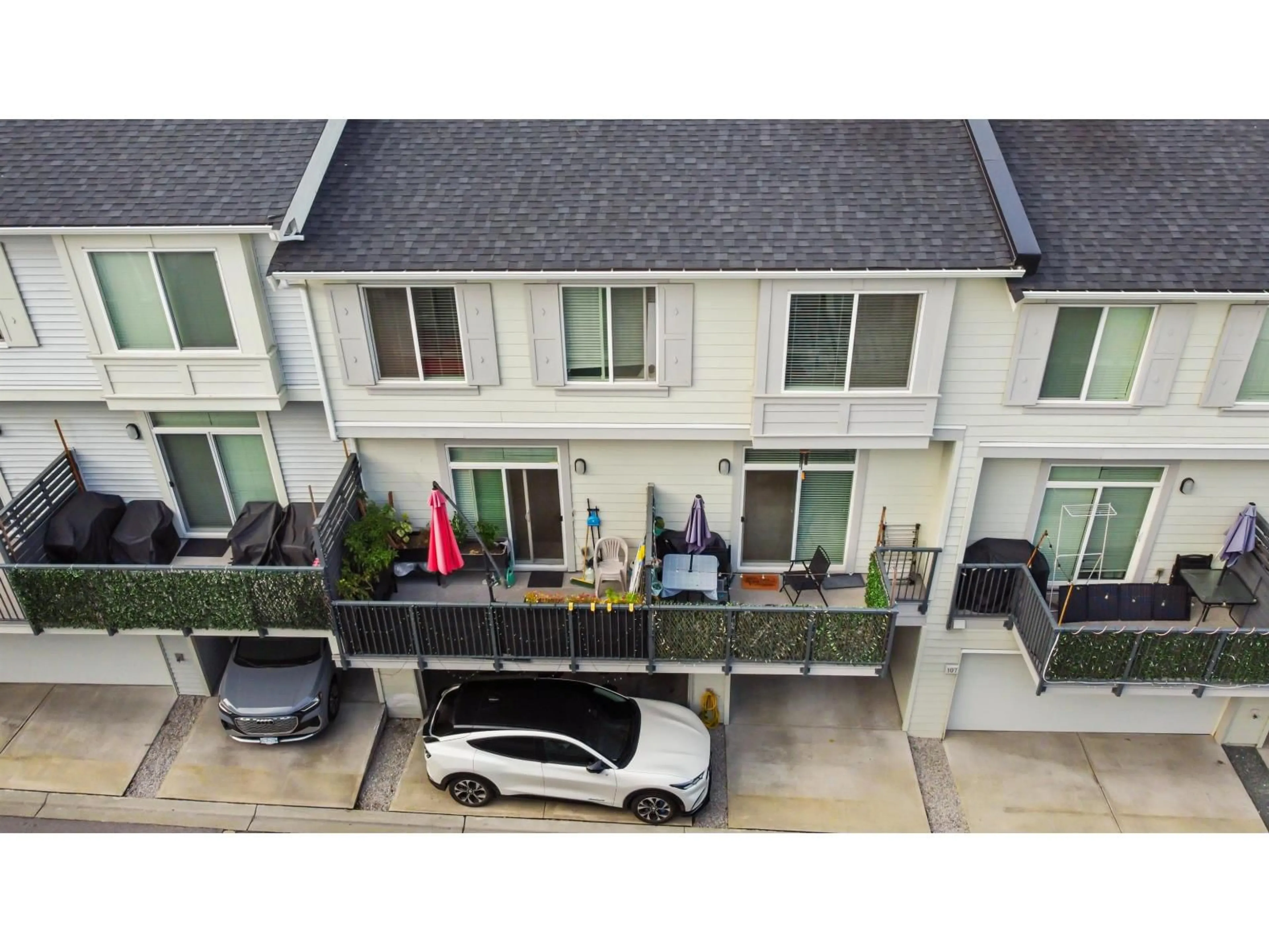 A pic from outside/outdoor area/front of a property/back of a property/a pic from drone, street for 109 - 8168 136A, Surrey British Columbia V3W2Z6