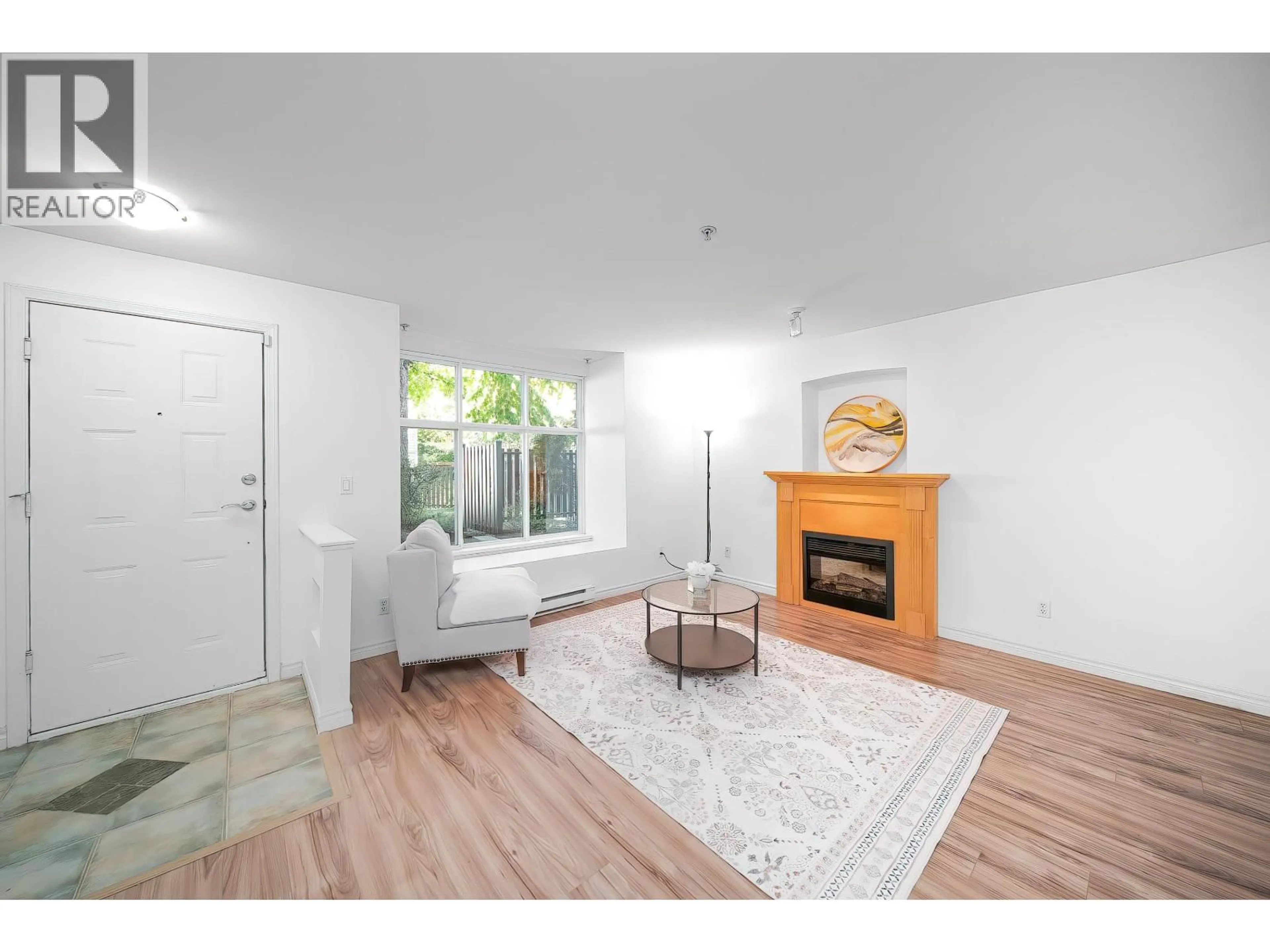 Living room with furniture, wood/laminate floor for 30 - 7128 STRIDE AVENUE, Burnaby British Columbia V3N1T5