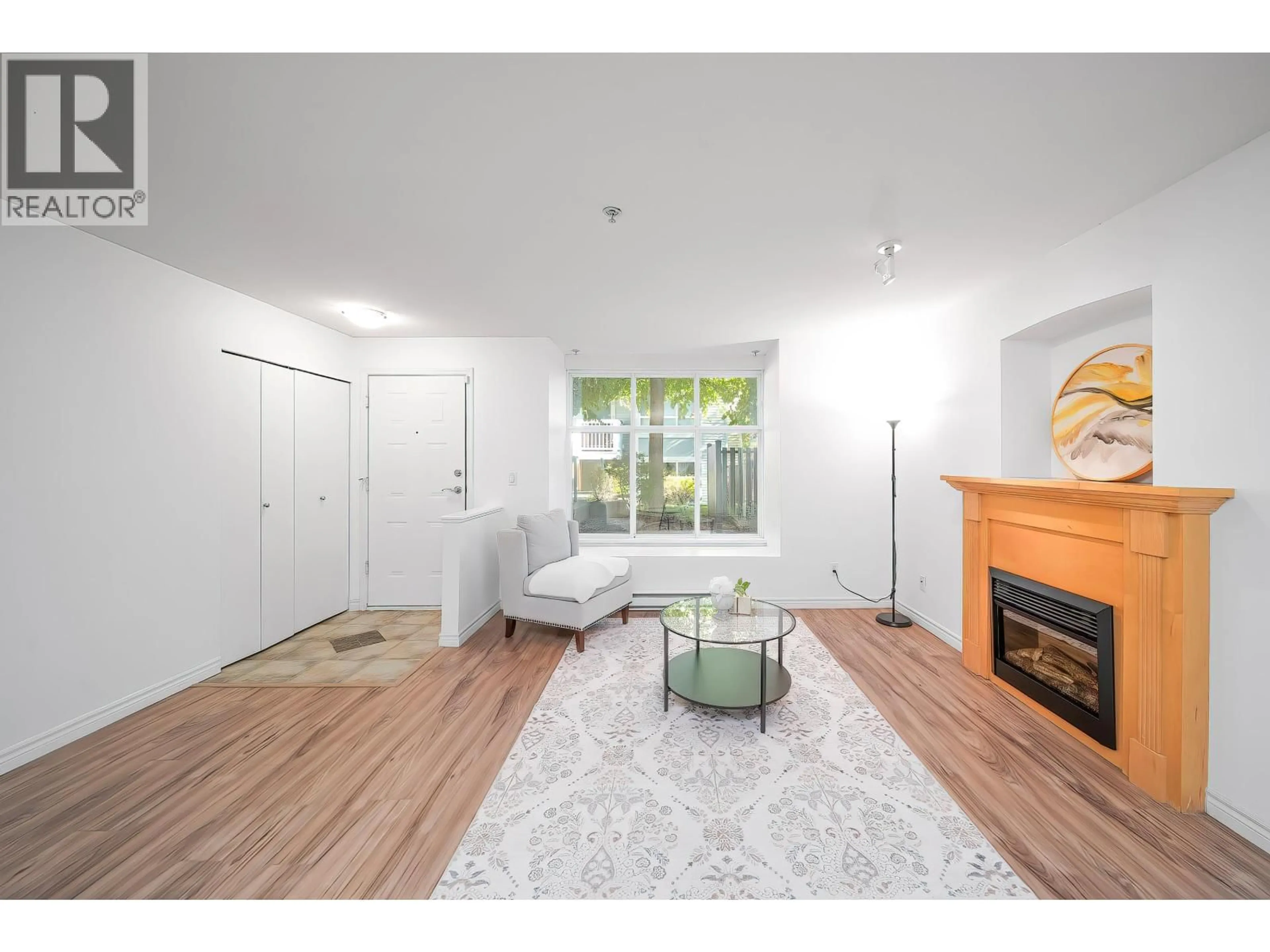 Living room with furniture, wood/laminate floor for 30 - 7128 STRIDE AVENUE, Burnaby British Columbia V3N1T5