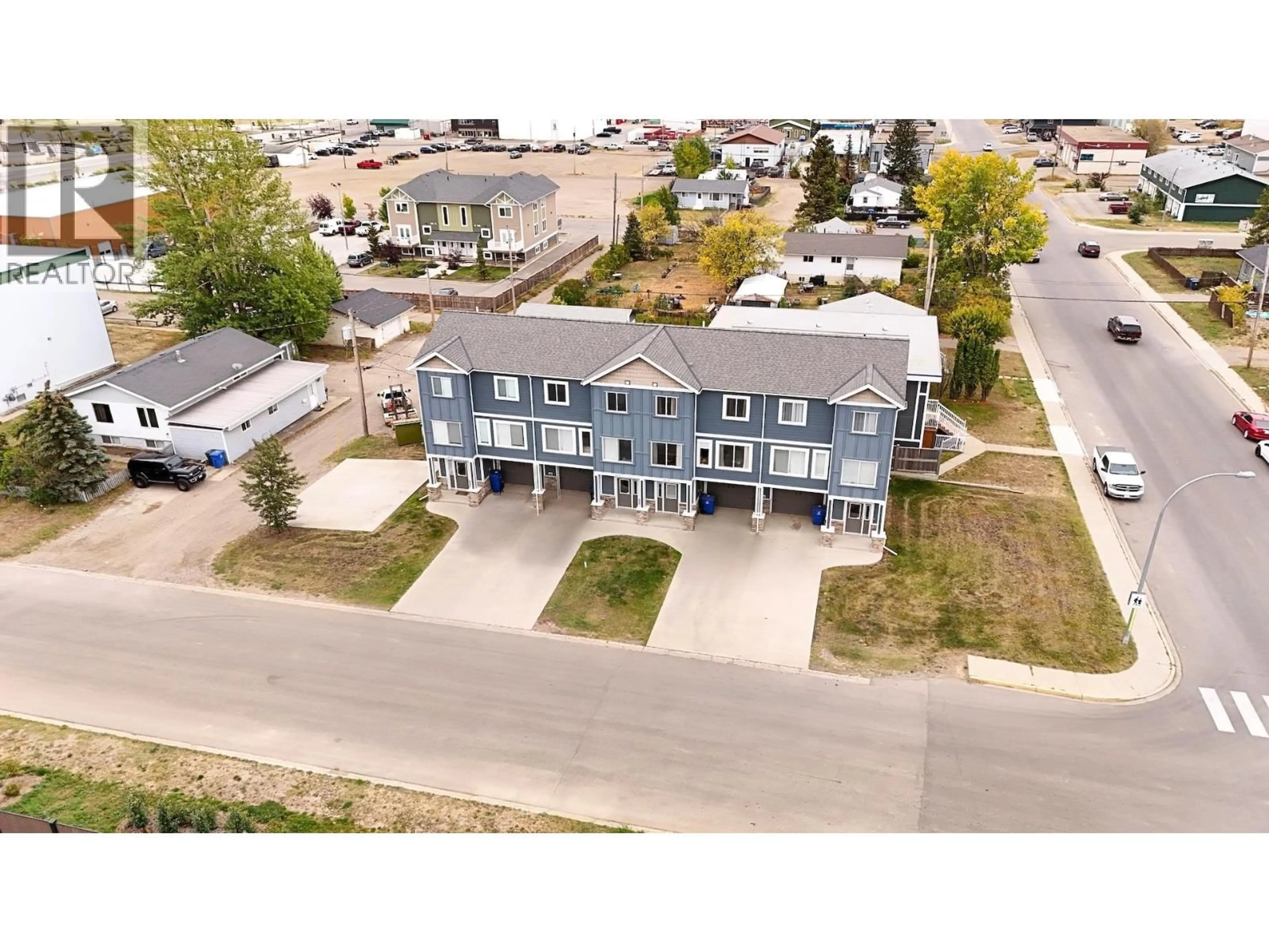 A pic from outside/outdoor area/front of a property/back of a property/a pic from drone, street for 10115 - - 10121 97 AVENUE, Fort St. John British Columbia V1J1N8