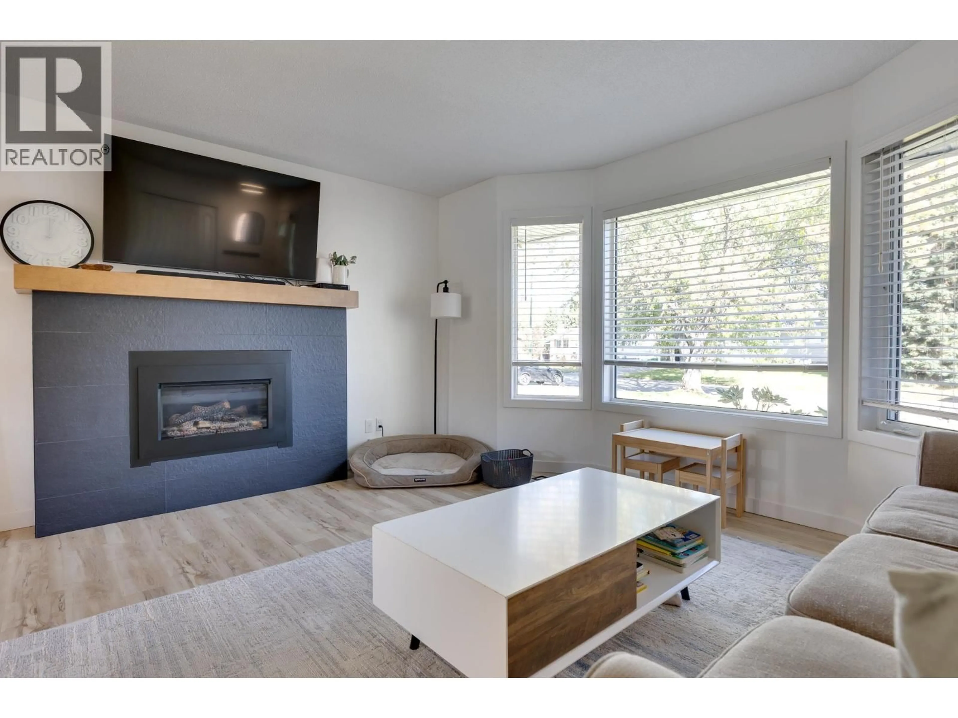 Living room with furniture, wood/laminate floor for 1051 NELSON CRESCENT, Prince George British Columbia V2M5A1