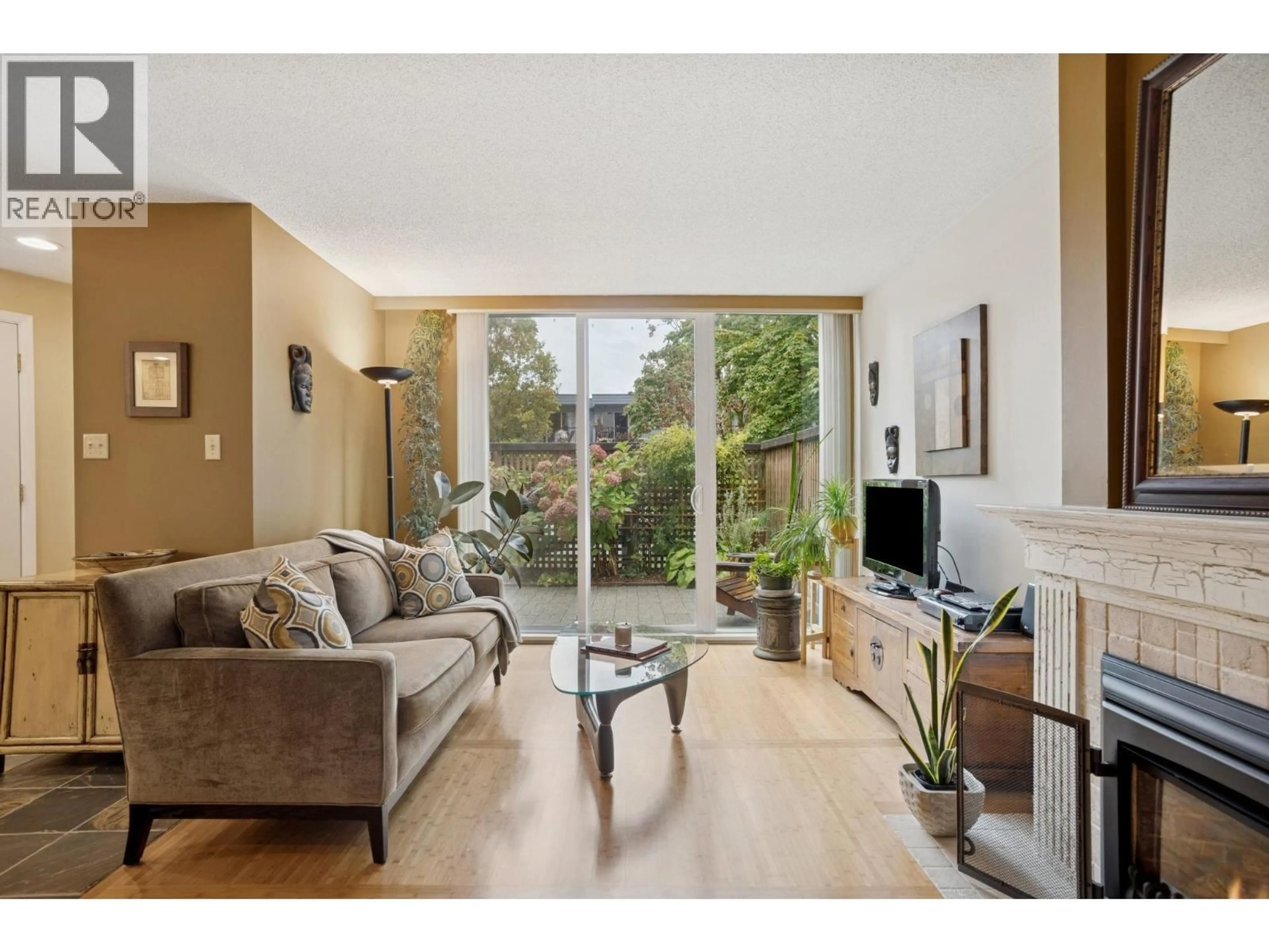 Living room with furniture, wood/laminate floor for 3917 PENDER STREET, Burnaby British Columbia V5C2L7