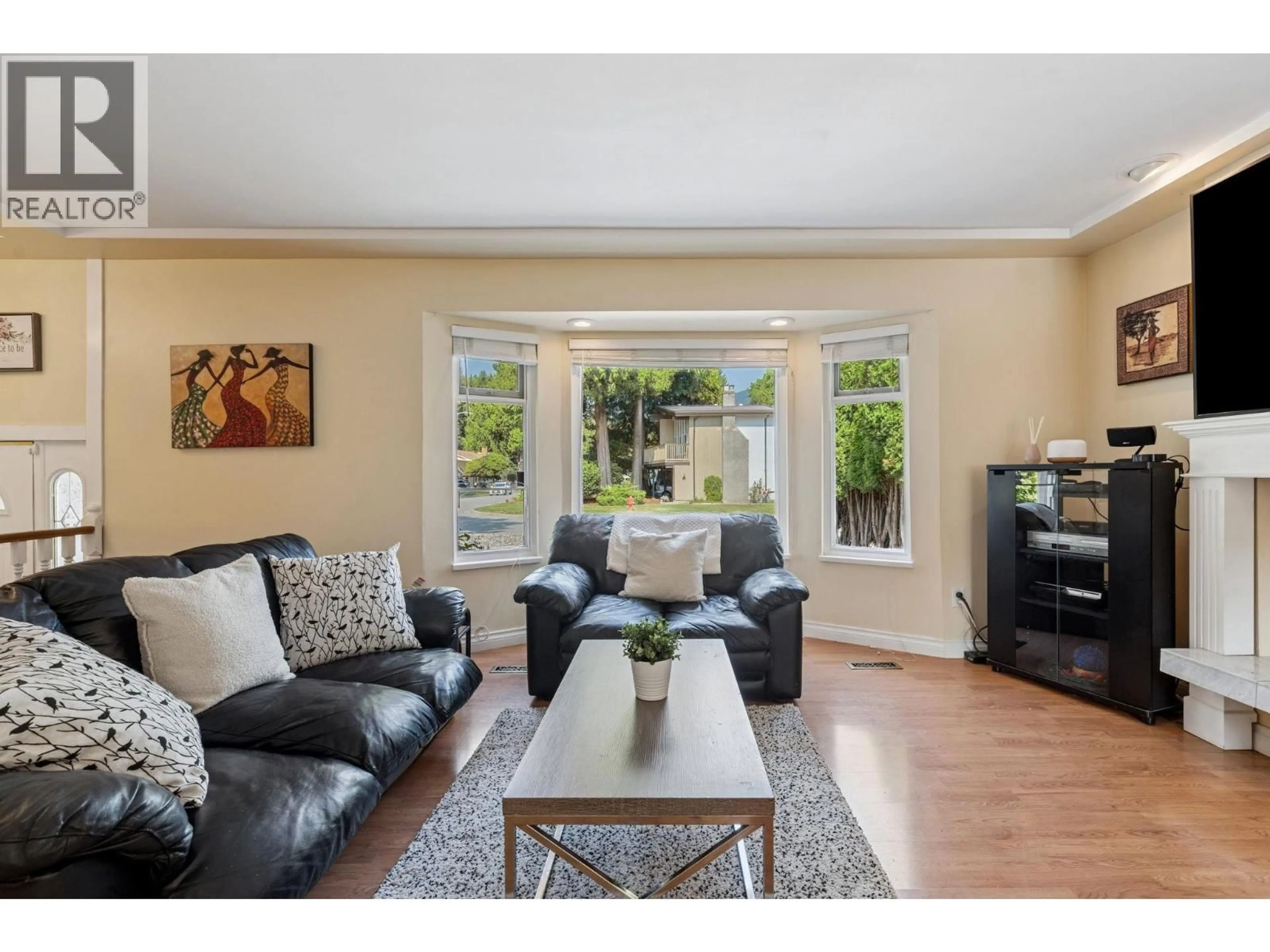 Living room with furniture, wood/laminate floor for 1068 SPRUCE STREET, Port Coquitlam British Columbia V3B4X6