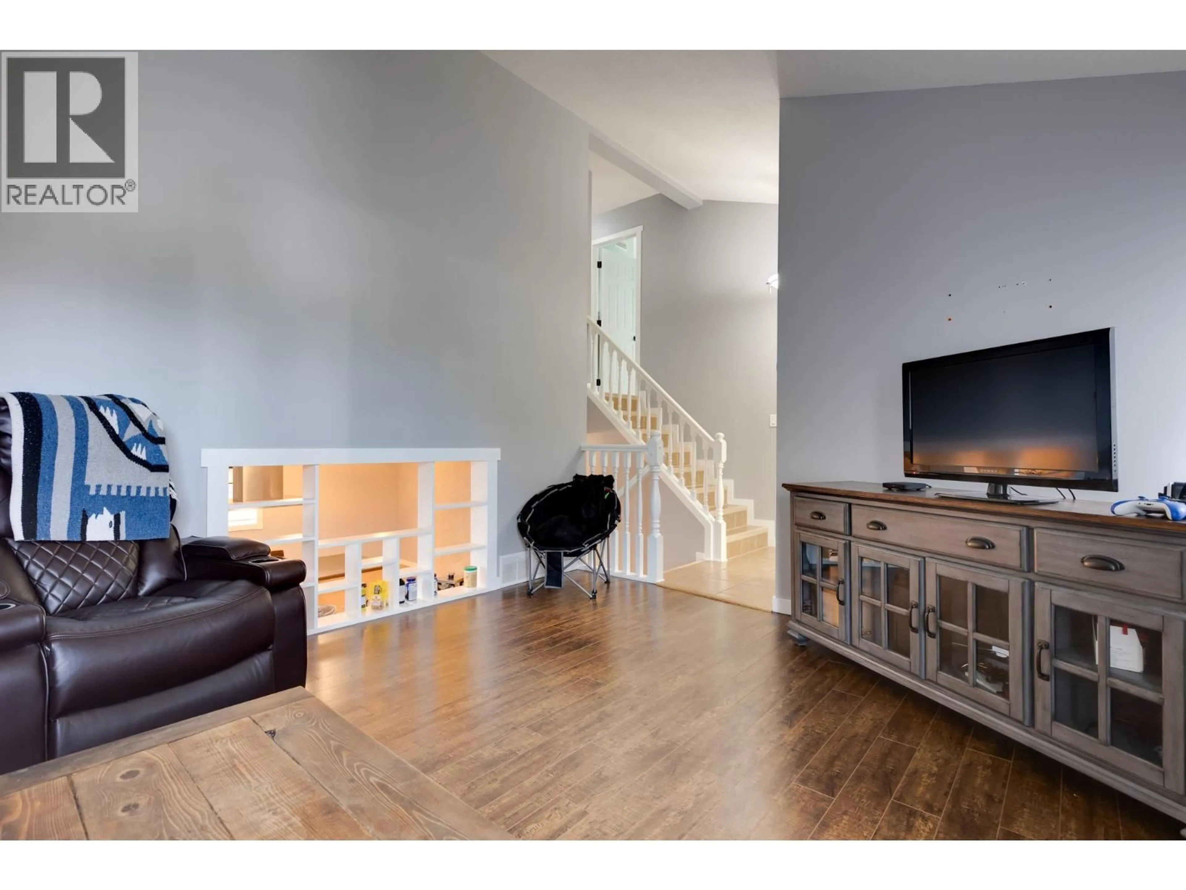 Living room with furniture, wood/laminate floor for 2901 CHRISTOPHER CRESCENT, Prince George British Columbia V2N4S4