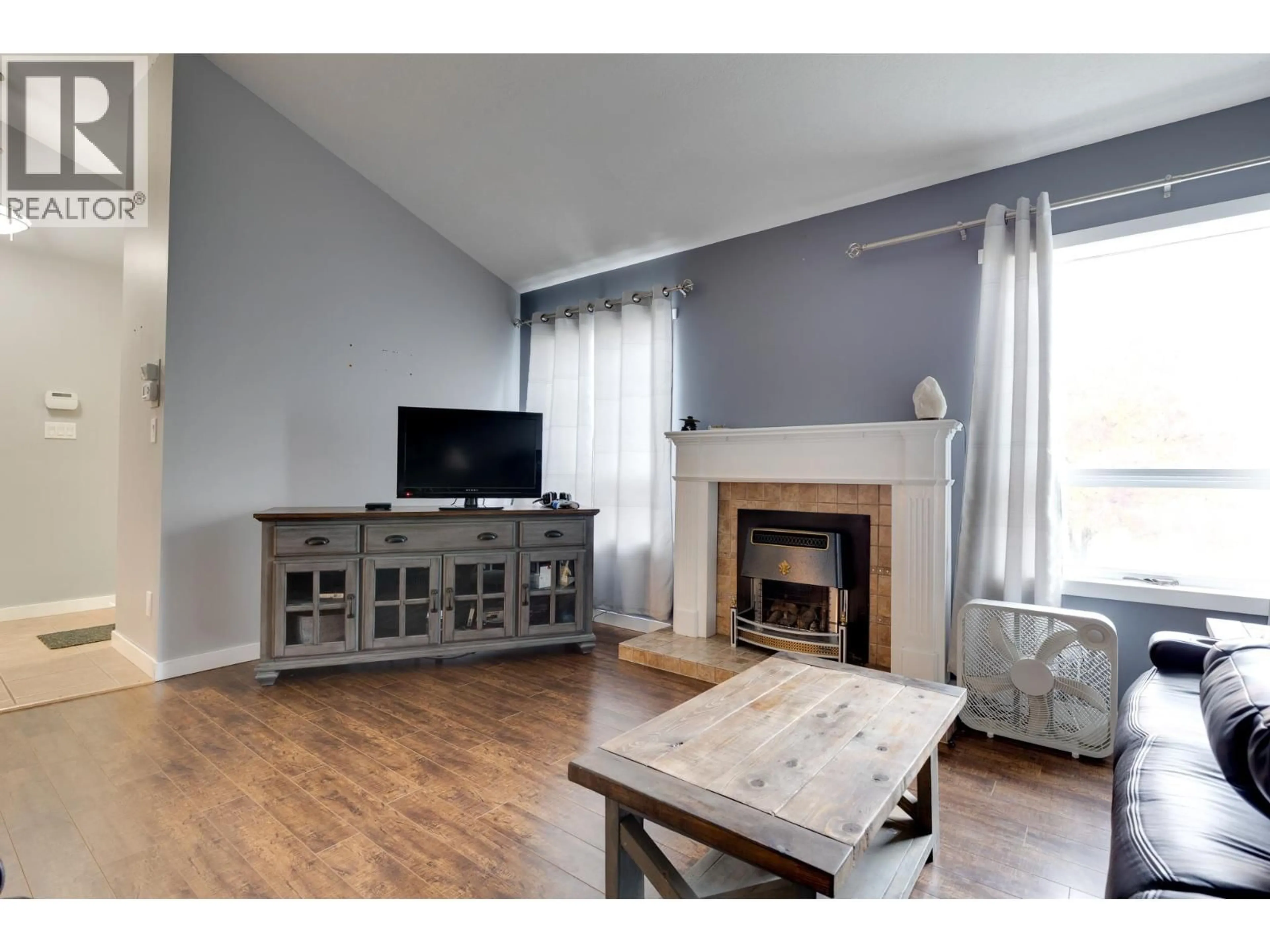 Living room with furniture, wood/laminate floor for 2901 CHRISTOPHER CRESCENT, Prince George British Columbia V2N4S4