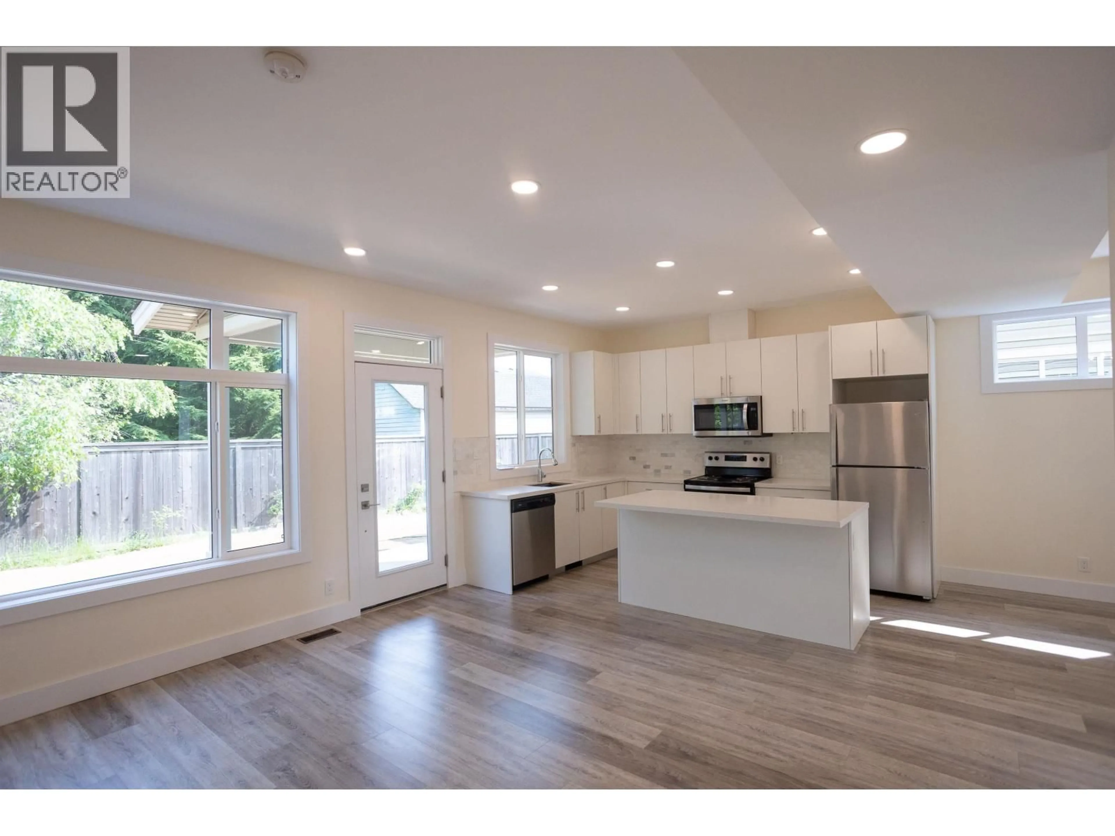 Open concept kitchen, wood/laminate floor for 23 - 3701 CORY DRIVE, Terrace British Columbia V8G0J6