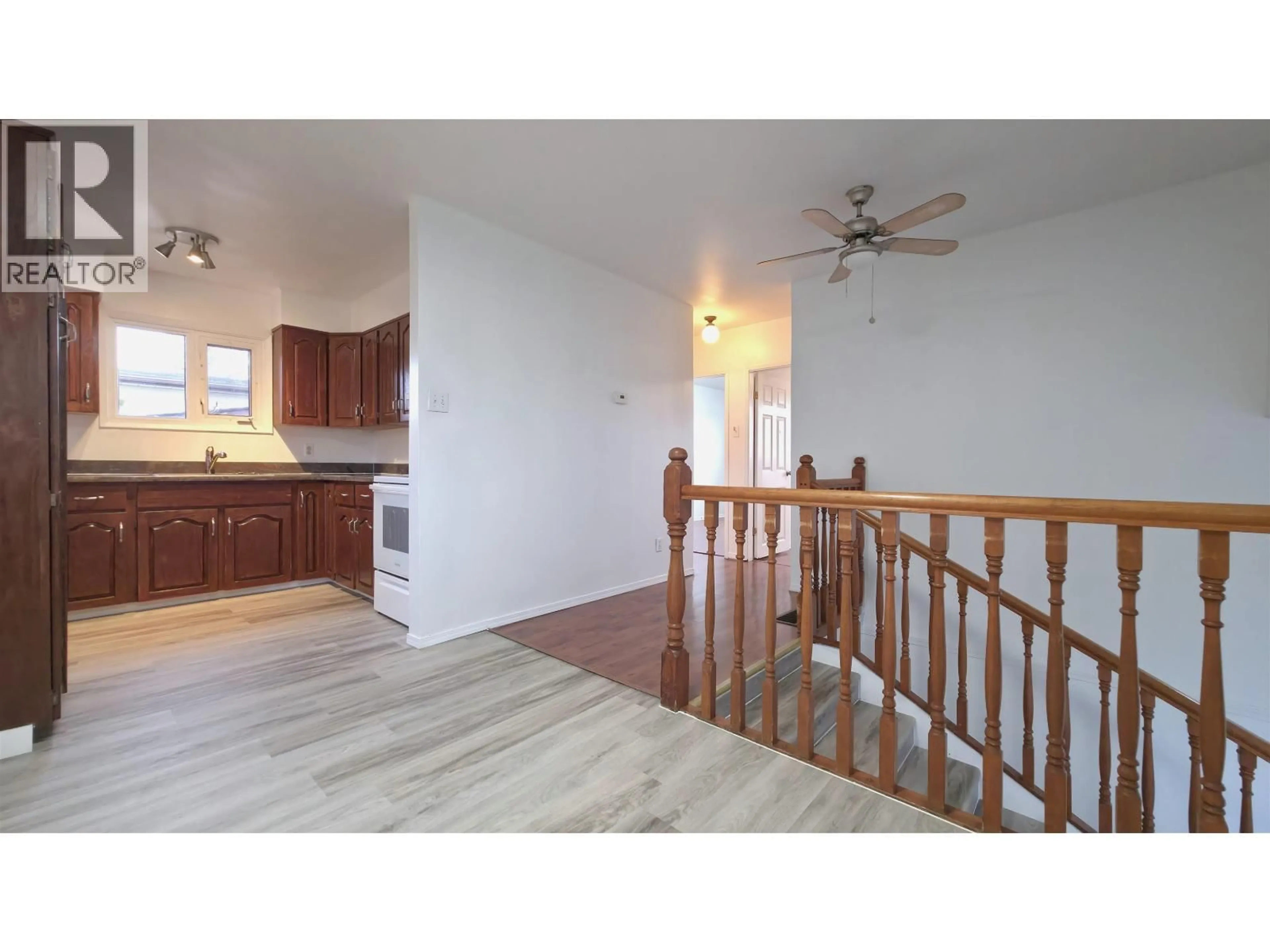 Open concept kitchen, wood/laminate floor for 1016 IRWIN STREET, Prince George British Columbia V2M2Y2