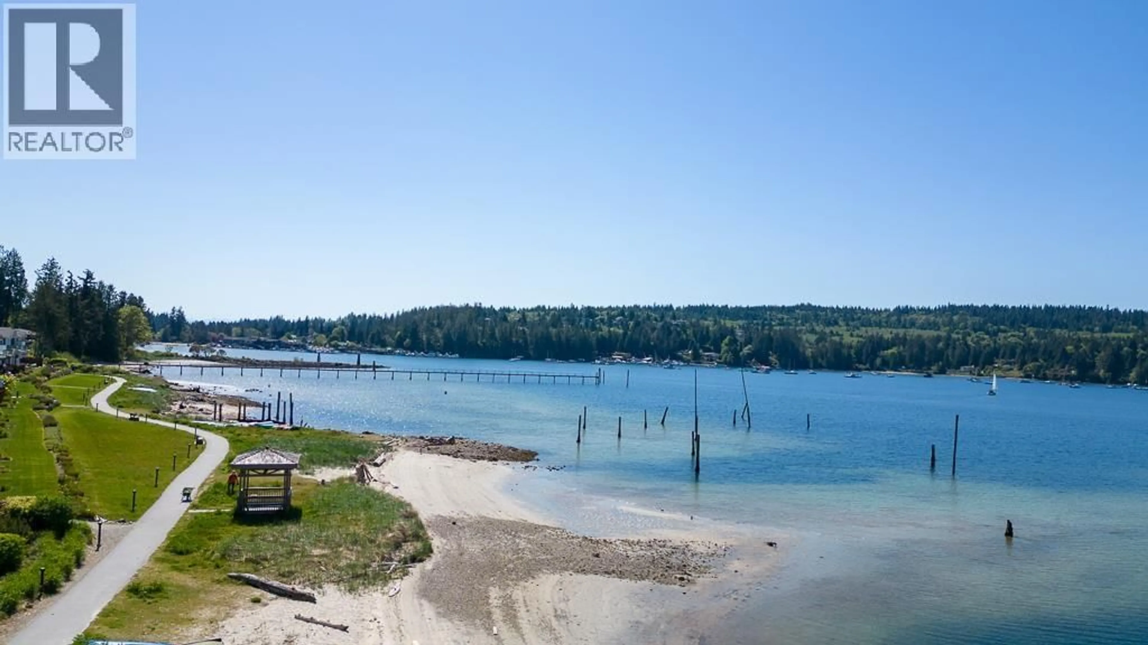 A pic from outside/outdoor area/front of a property/back of a property/a pic from drone, water/lake/river/ocean view for 5993 BEACHGATE LANE, Sechelt British Columbia V7Z0S2