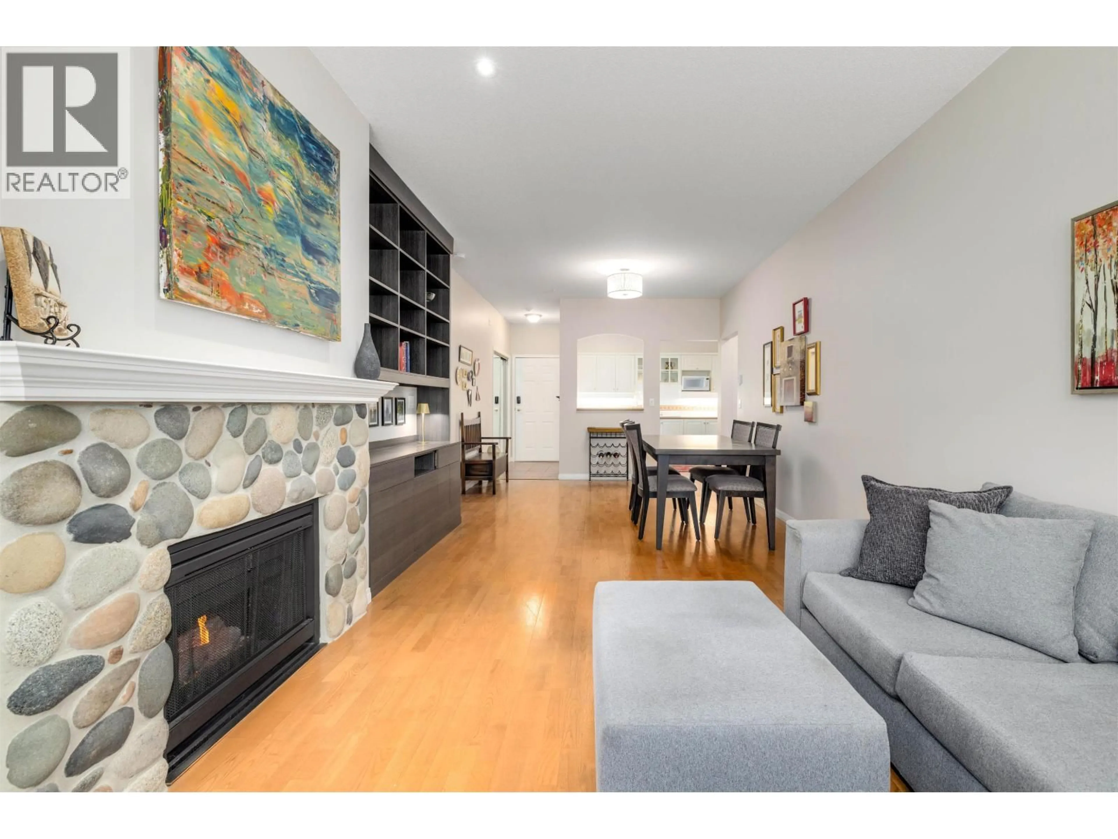Living room with furniture, wood/laminate floor for 121 - 12931 RAILWAY AVENUE, Richmond British Columbia V7E6M5