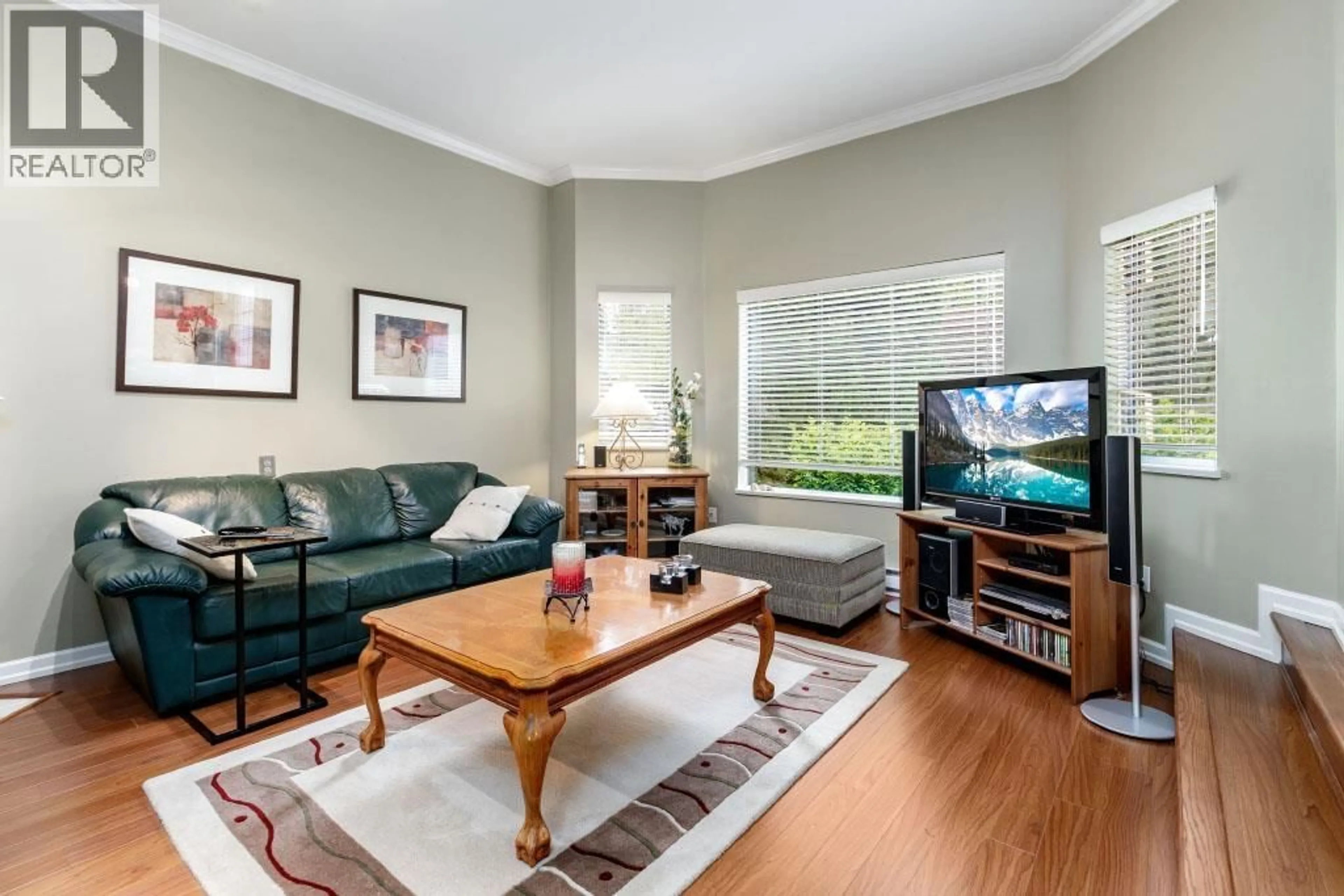 Living room with furniture, wood/laminate floor for 6 - 1135 LANSDOWNE DRIVE, Coquitlam British Columbia V3B7K6
