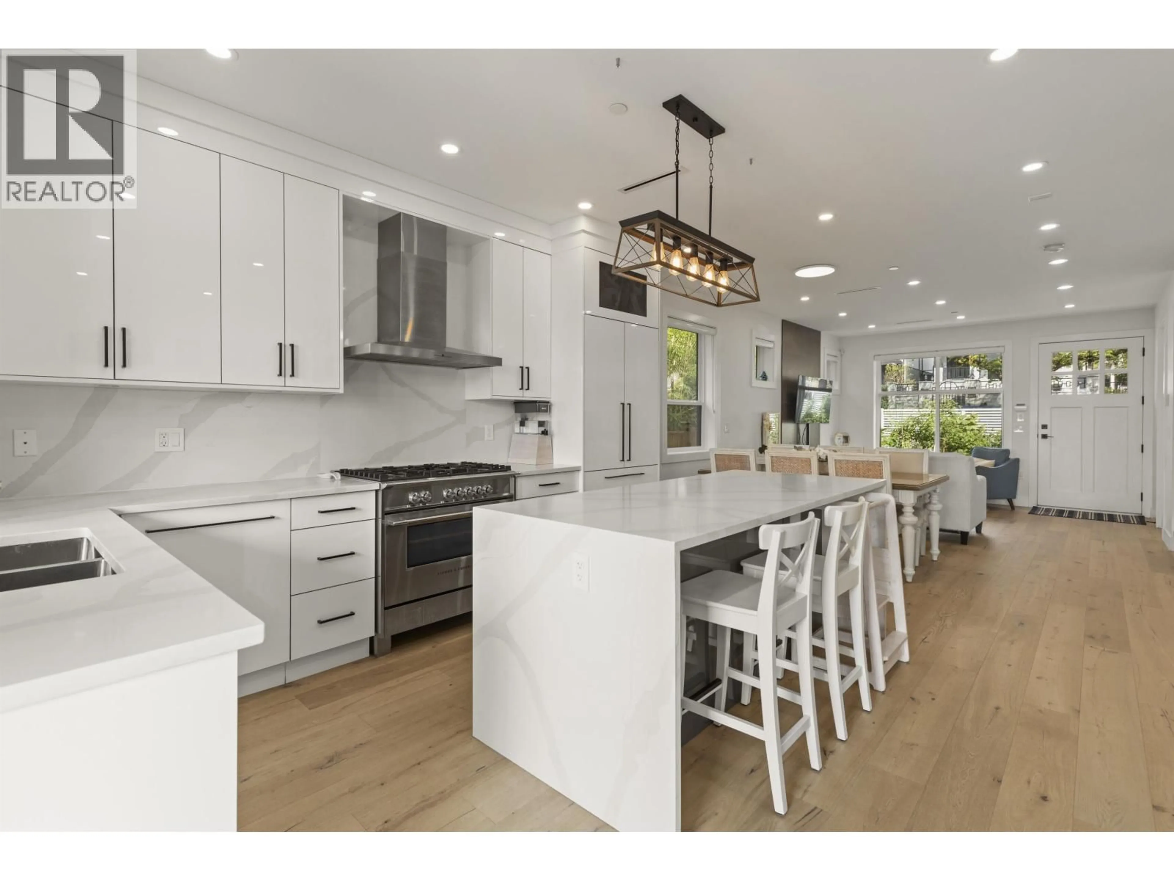 Open concept kitchen, wood/laminate floor for 2666 6TH AVENUE, Vancouver British Columbia V5M1R3