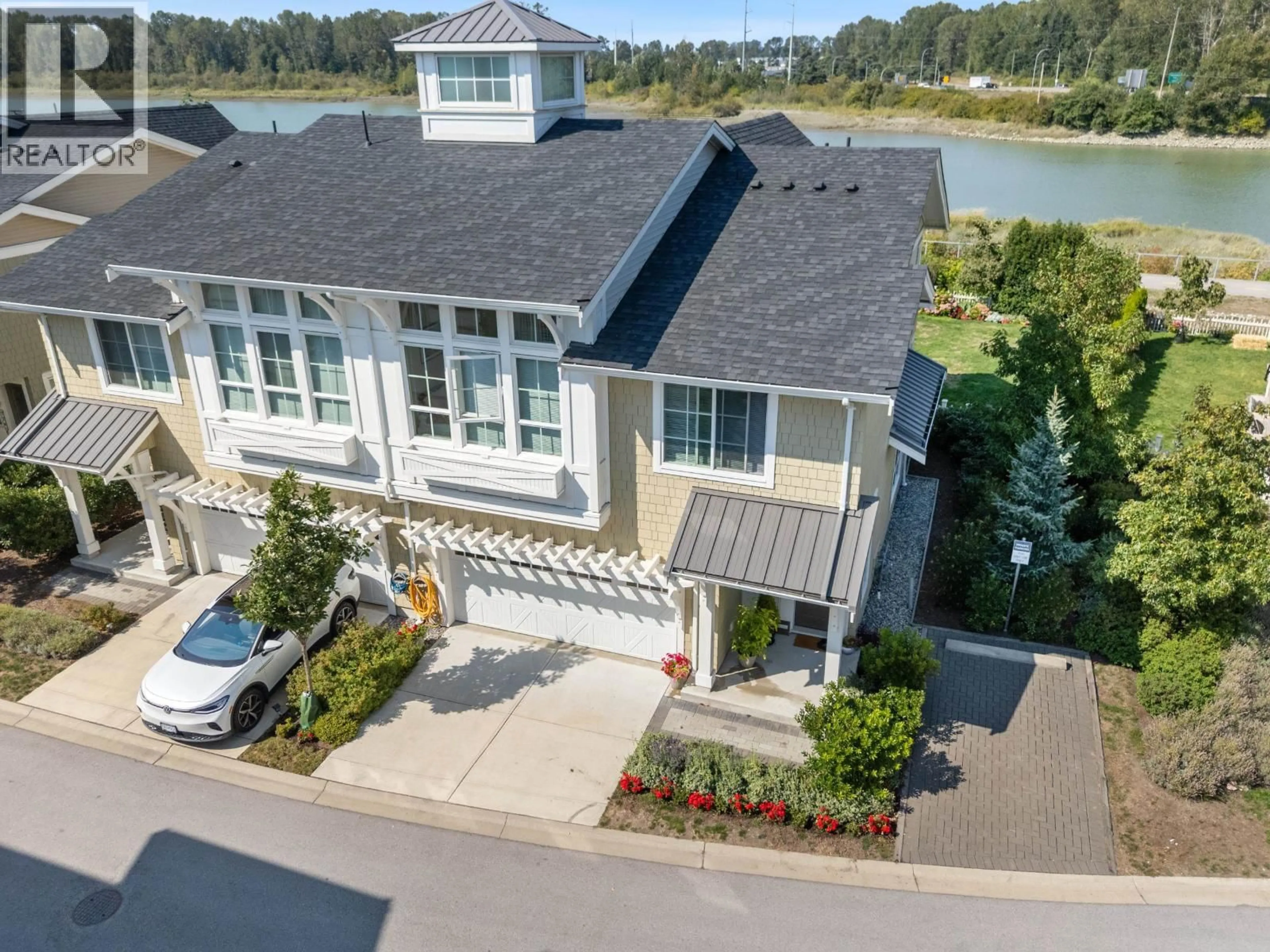 A pic from outside/outdoor area/front of a property/back of a property/a pic from drone, water/lake/river/ocean view for 12B - 5551 ADMIRAL WAY, Ladner British Columbia V4K0C9