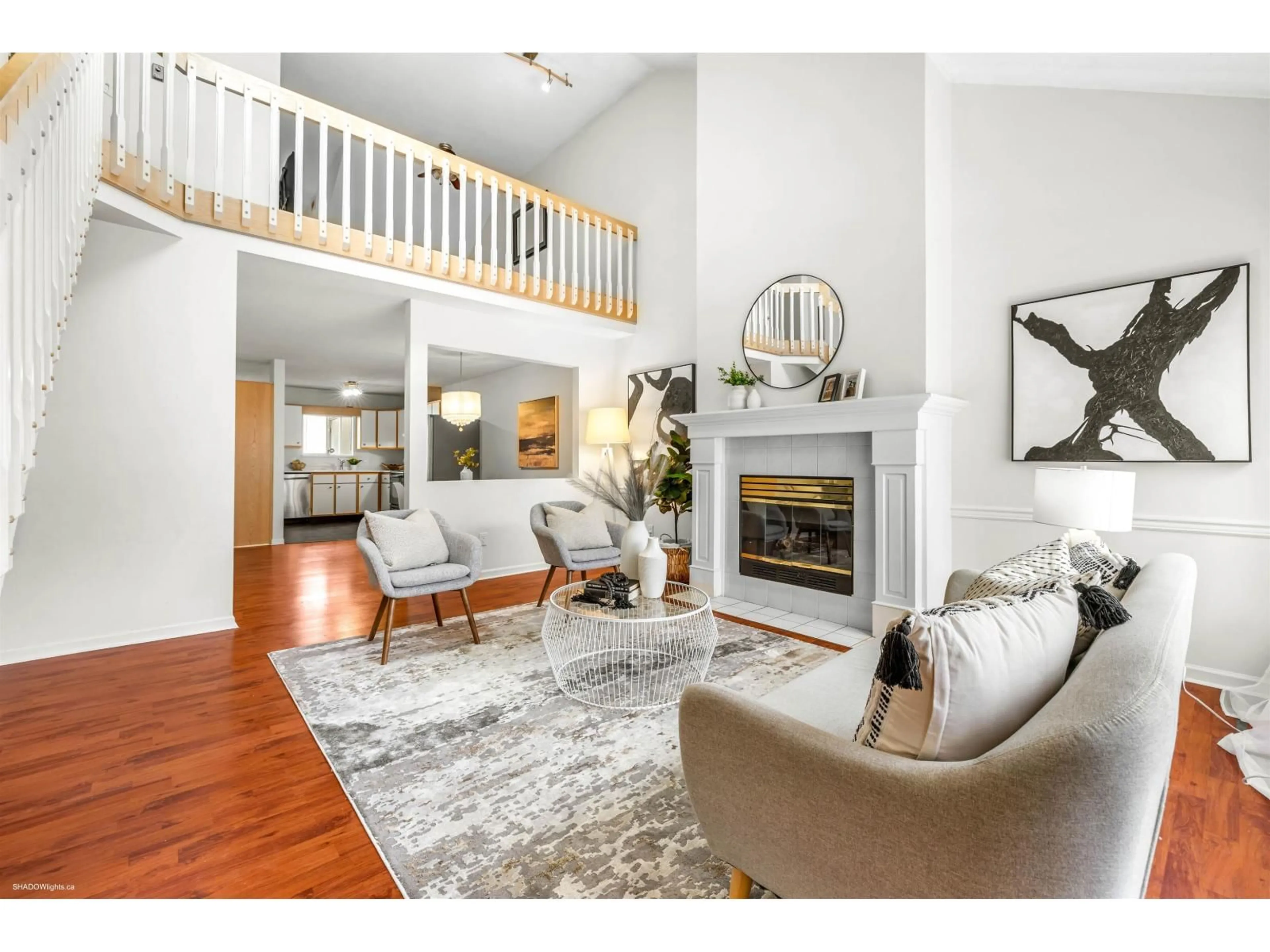 Living room with furniture, wood/laminate floor for 222 - 7837 120A, Surrey British Columbia V3W0W9