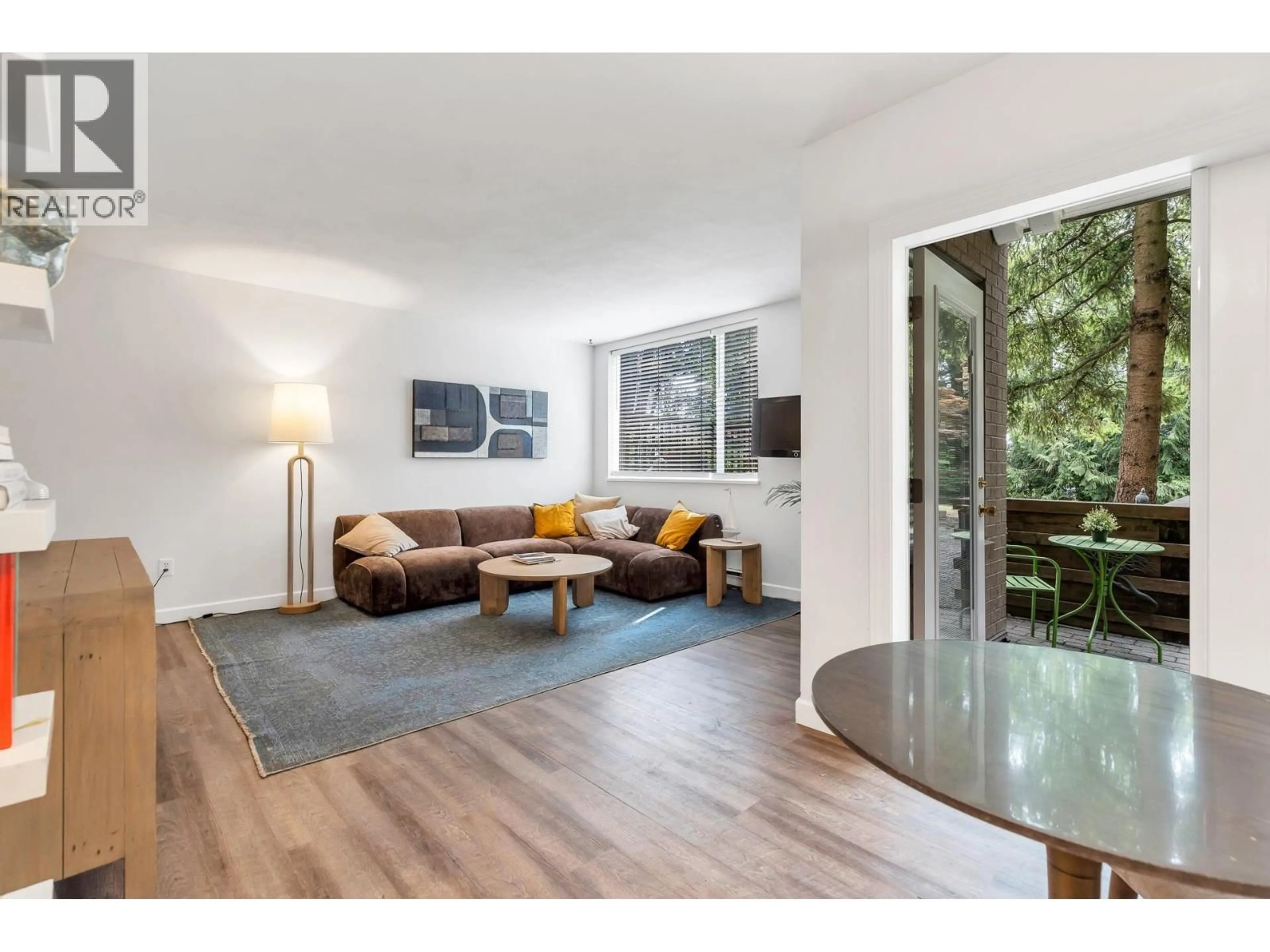 Living room with furniture, wood/laminate floor for 105 - 6742 STATION HILL COURT, Burnaby British Columbia V3N4V2