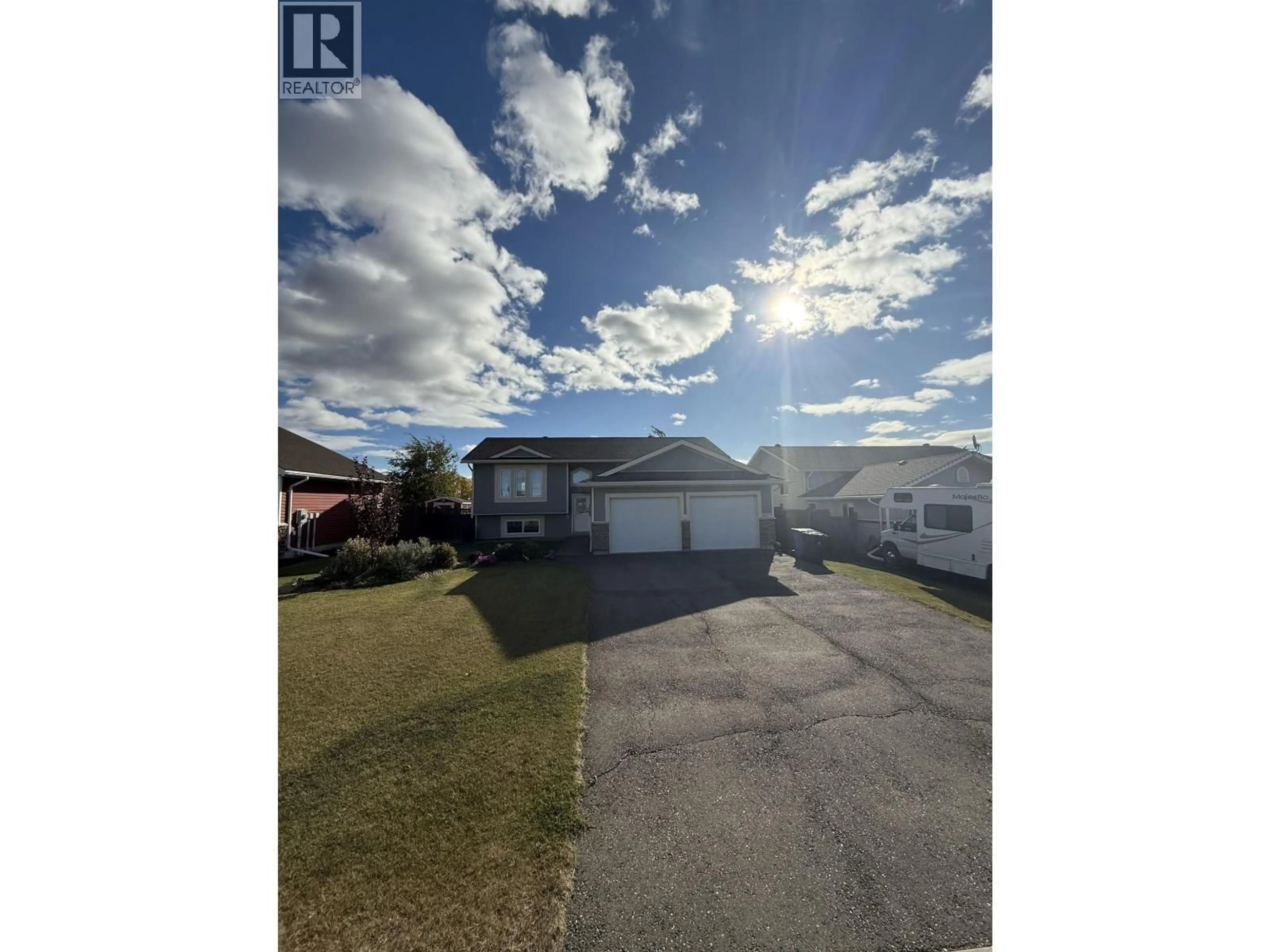 A pic from outside/outdoor area/front of a property/back of a property/a pic from drone, street for 8819 96A AVENUE, Fort St. John British Columbia V1J0A3