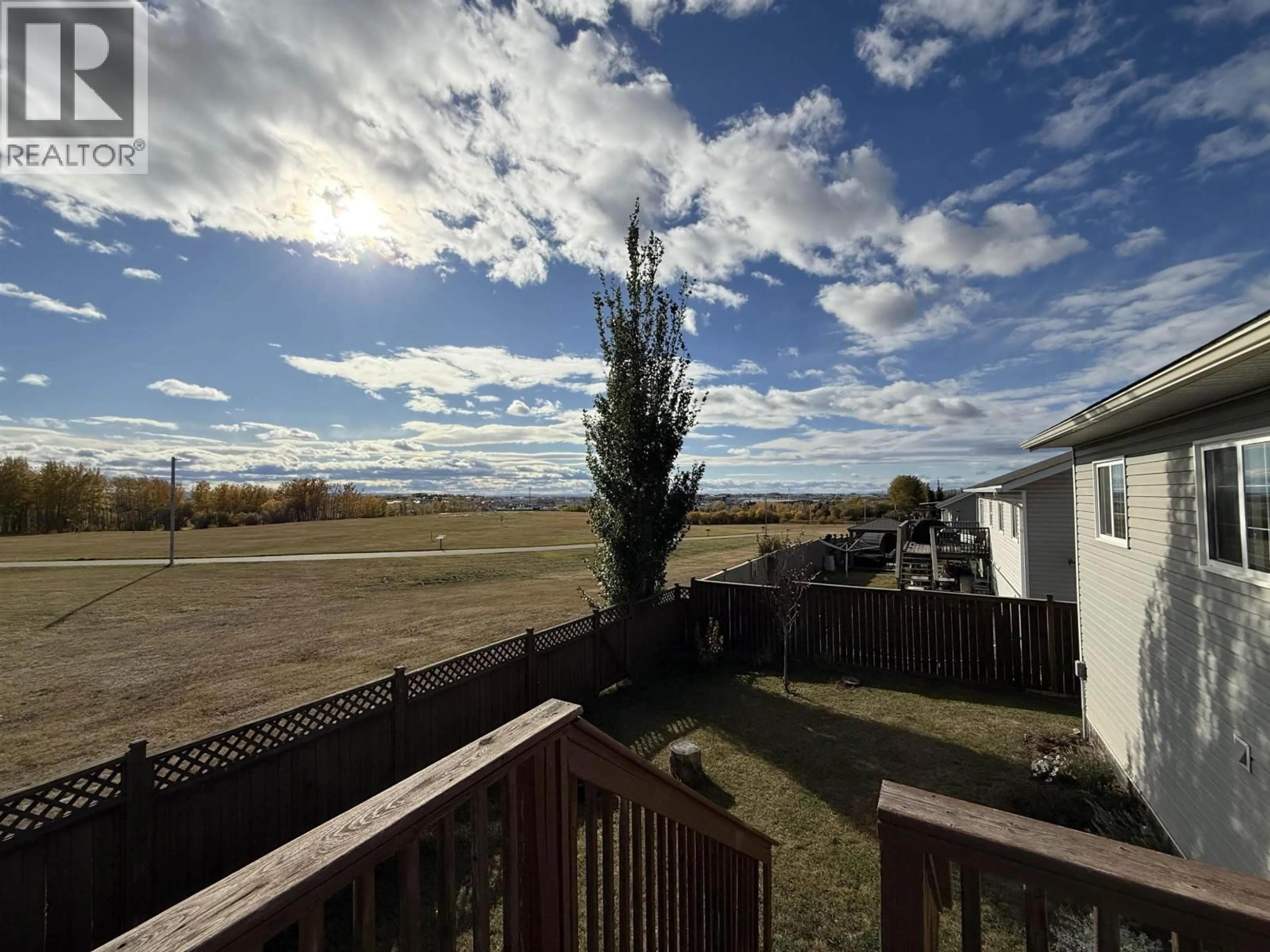 A pic from outside/outdoor area/front of a property/back of a property/a pic from drone, unknown for 8819 96A AVENUE, Fort St. John British Columbia V1J0A3