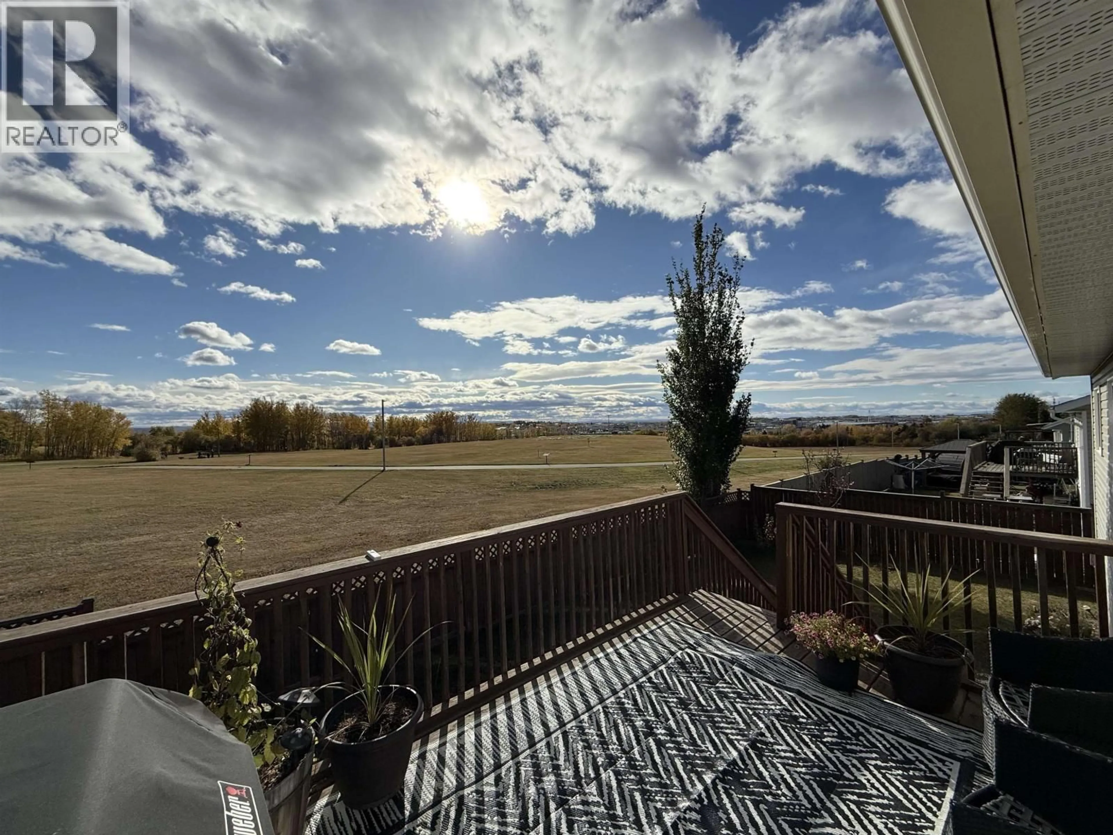 A pic from outside/outdoor area/front of a property/back of a property/a pic from drone, water/lake/river/ocean view for 8819 96A AVENUE, Fort St. John British Columbia V1J0A3