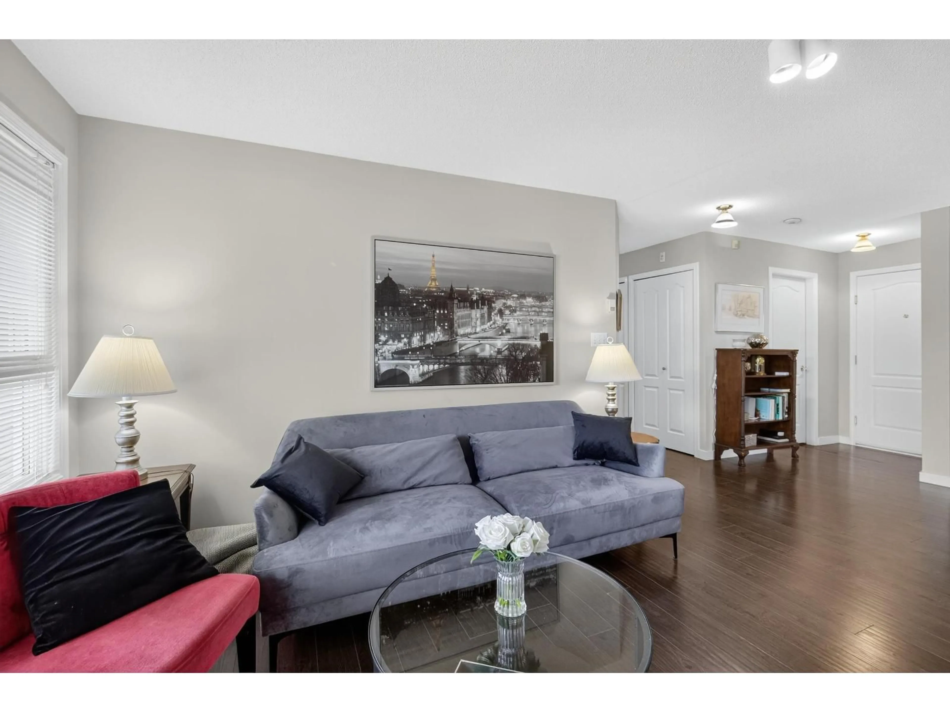Living room with furniture, wood/laminate floor for 107 - 17740 58A, Surrey British Columbia V3S8M5