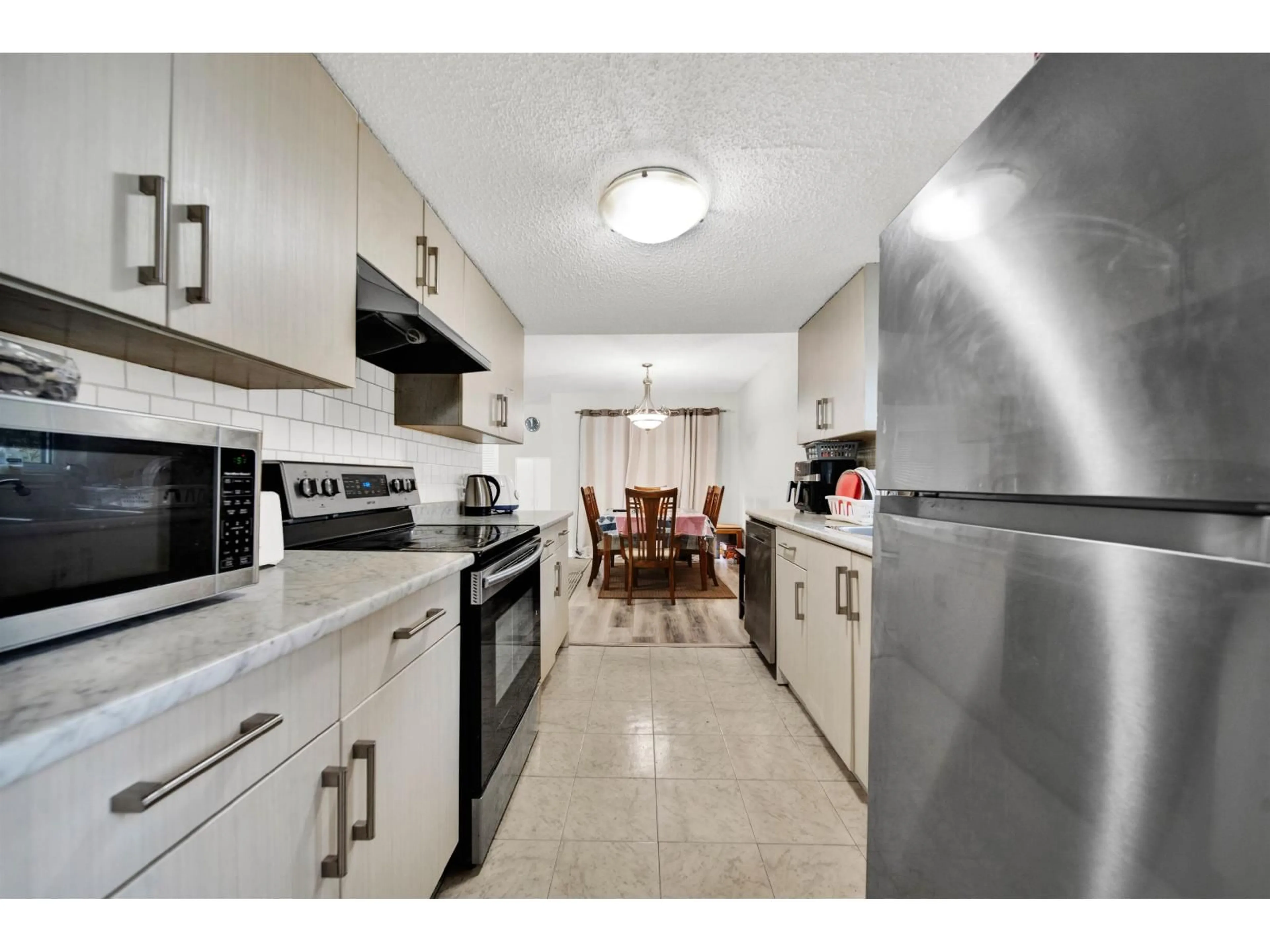 Standard kitchen, ceramic/tile floor for 104 - 13275 70B, Surrey British Columbia V3W7Z2