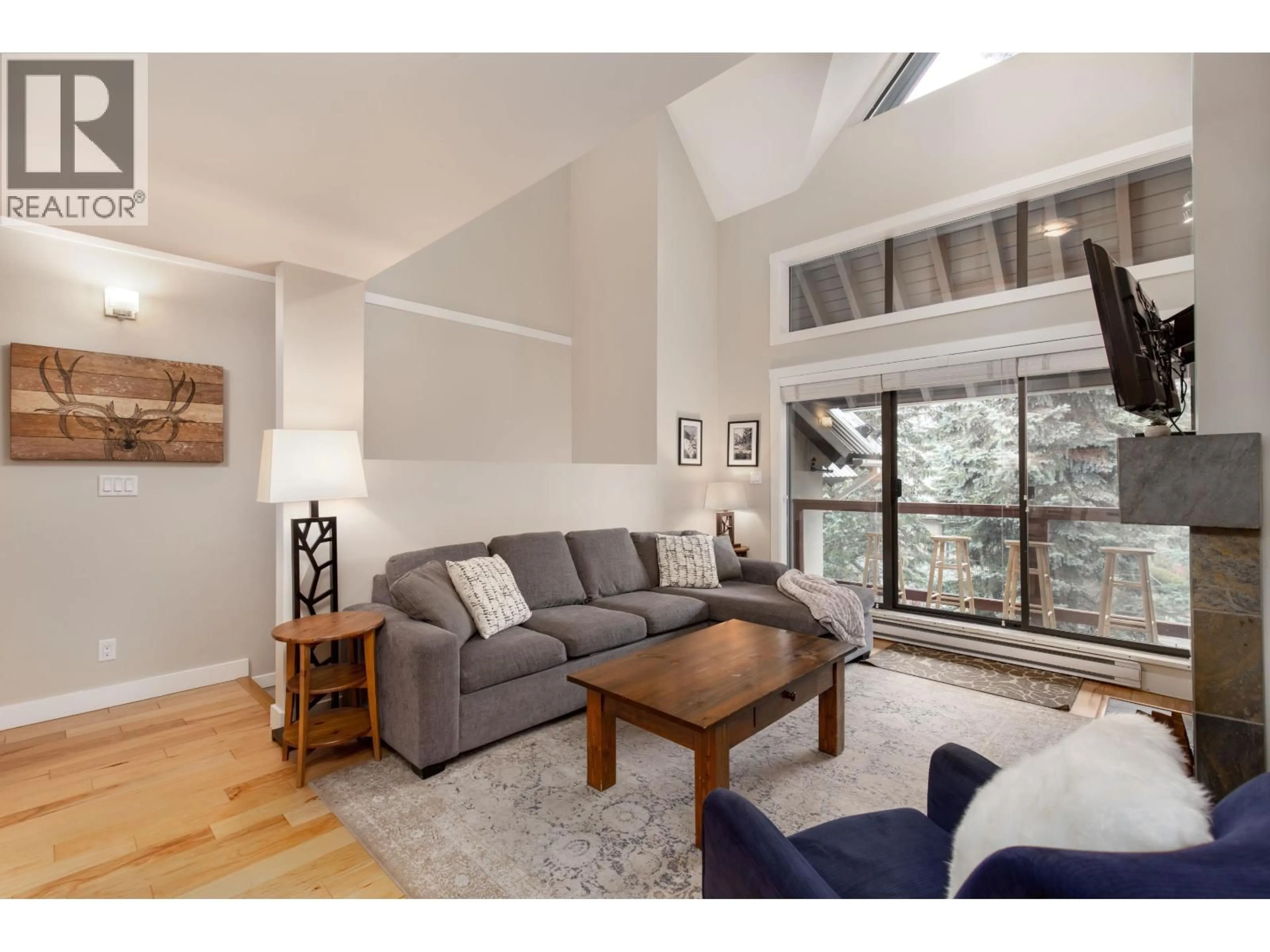 Living room with furniture, wood/laminate floor for 25 - 4637 BLACKCOMB WAY, Whistler British Columbia V8E0Y6