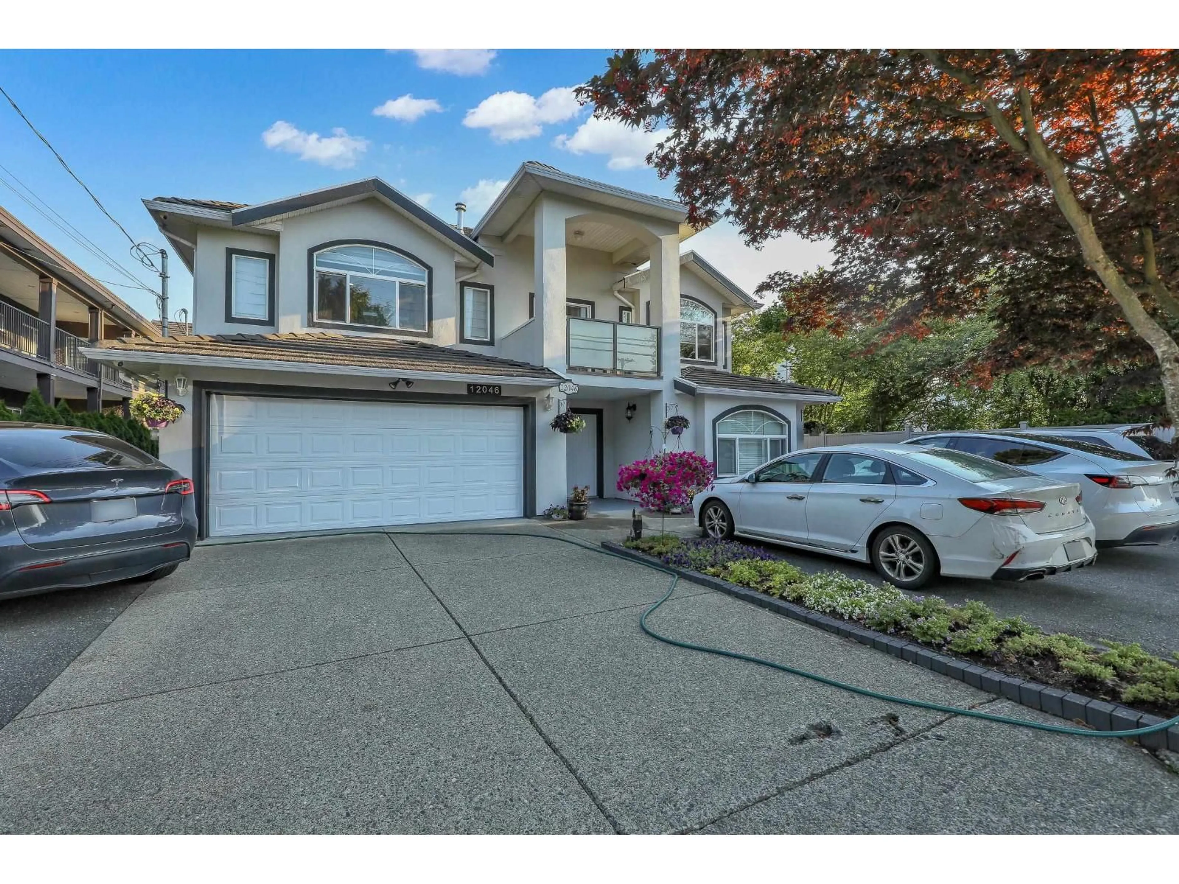 Home with vinyl exterior material, street for 12046 84, Surrey British Columbia V3W3G3