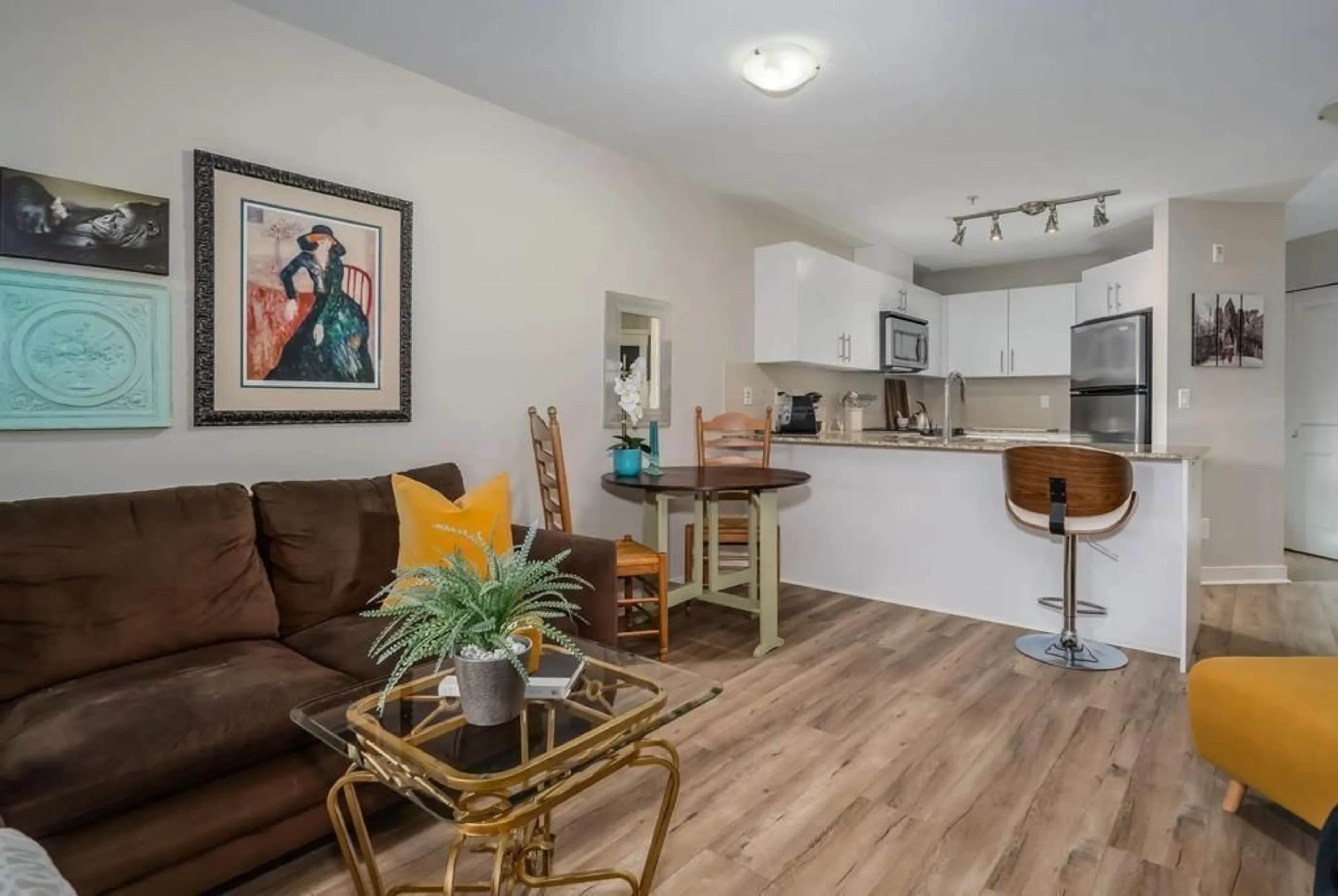 Living room with furniture, wood/laminate floor for 101 - 8915 202, Langley British Columbia V1M0B5