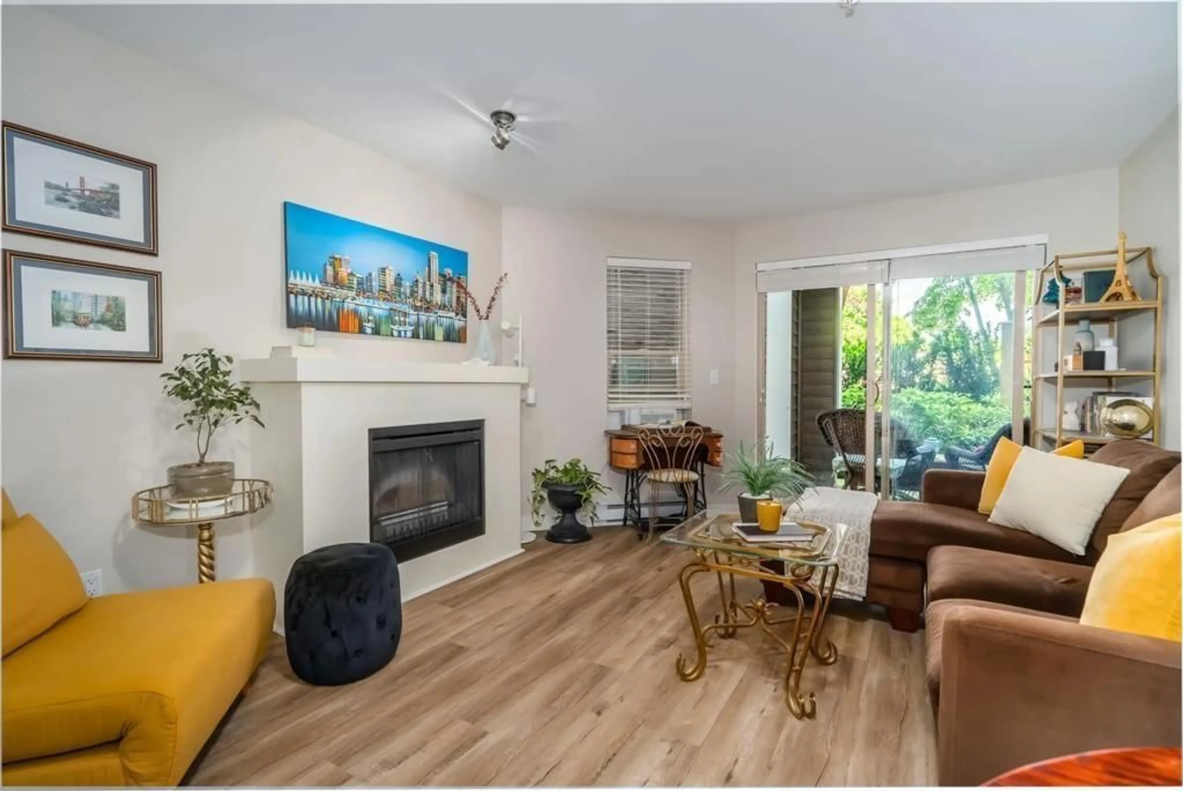 Living room with furniture, wood/laminate floor for 101 - 8915 202, Langley British Columbia V1M0B5