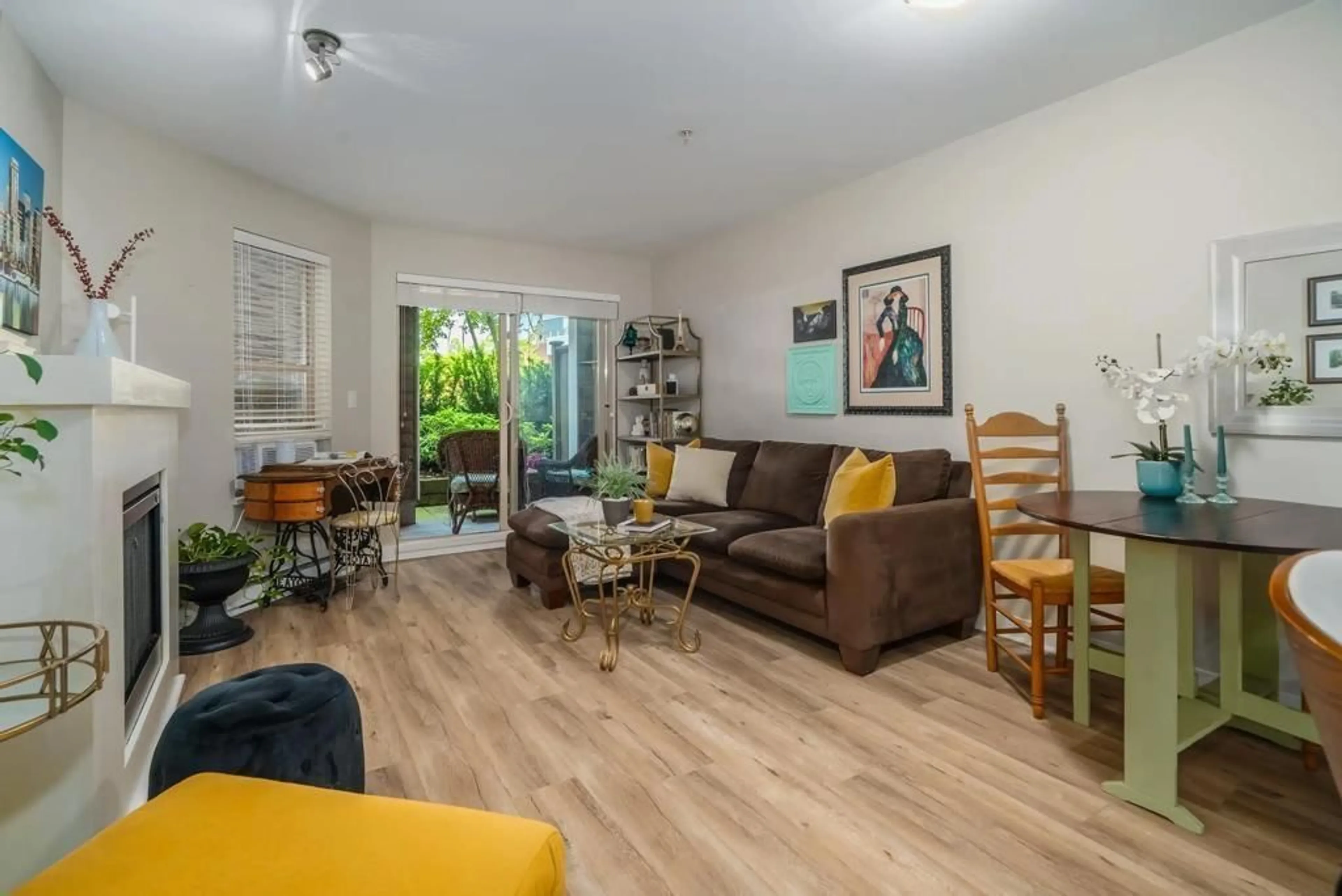Living room with furniture, wood/laminate floor for 101 - 8915 202, Langley British Columbia V1M0B5