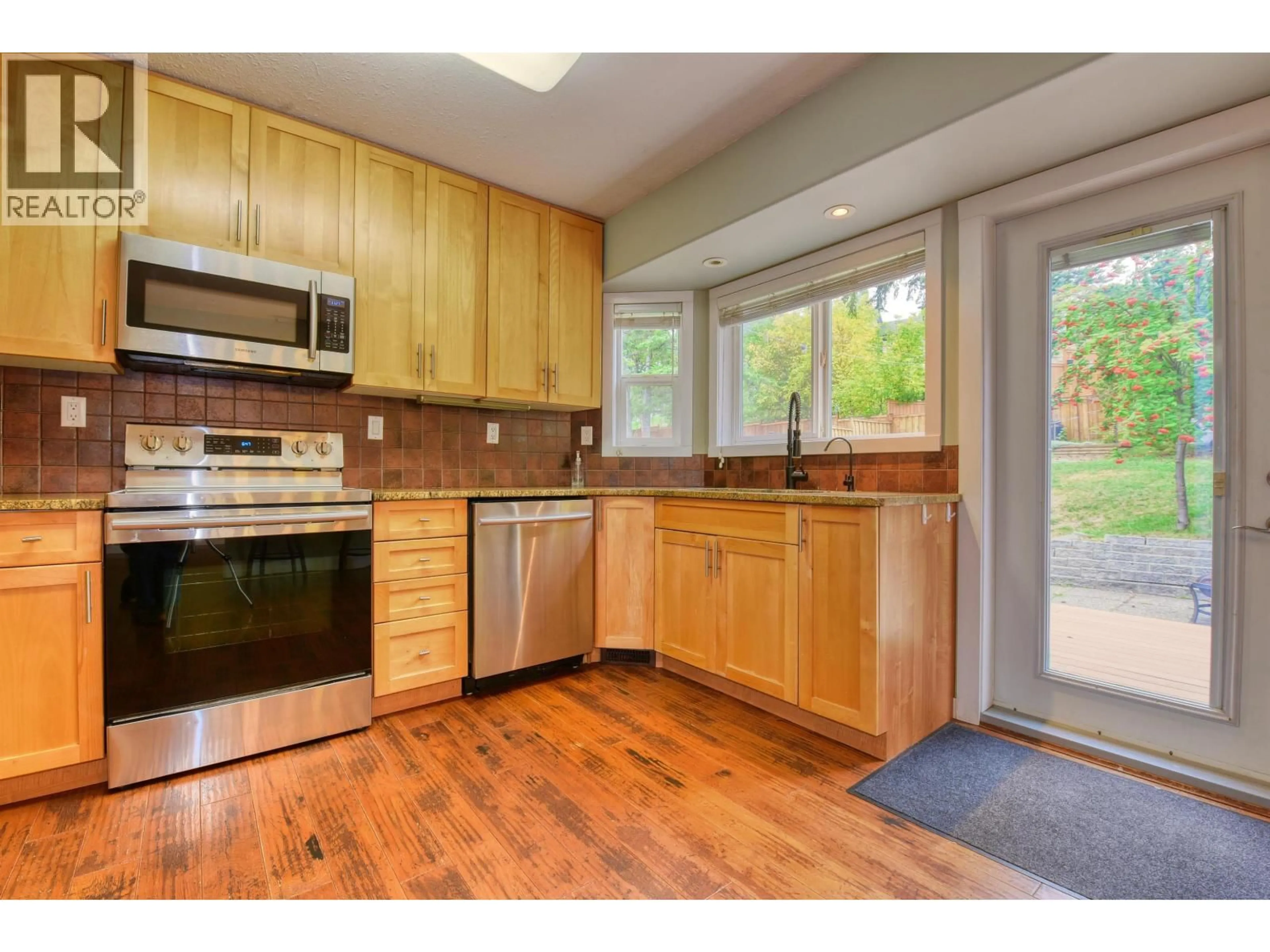 Open concept kitchen, wood/laminate floor for 123 WESTRIDGE DRIVE, Williams Lake British Columbia V2G5K4