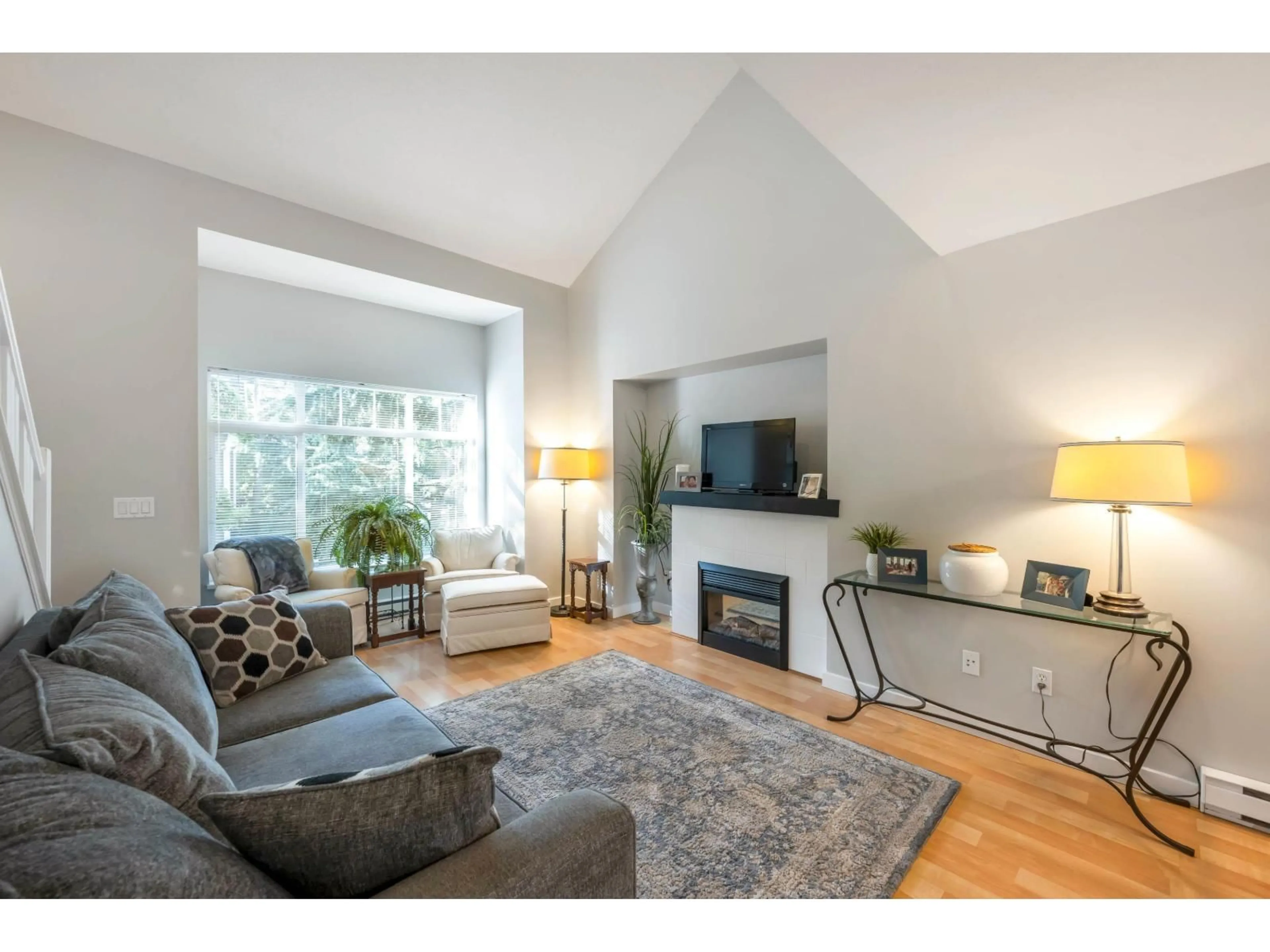 Living room with furniture, wood/laminate floor for 44 - 15233 34, Surrey British Columbia V3Z2T7