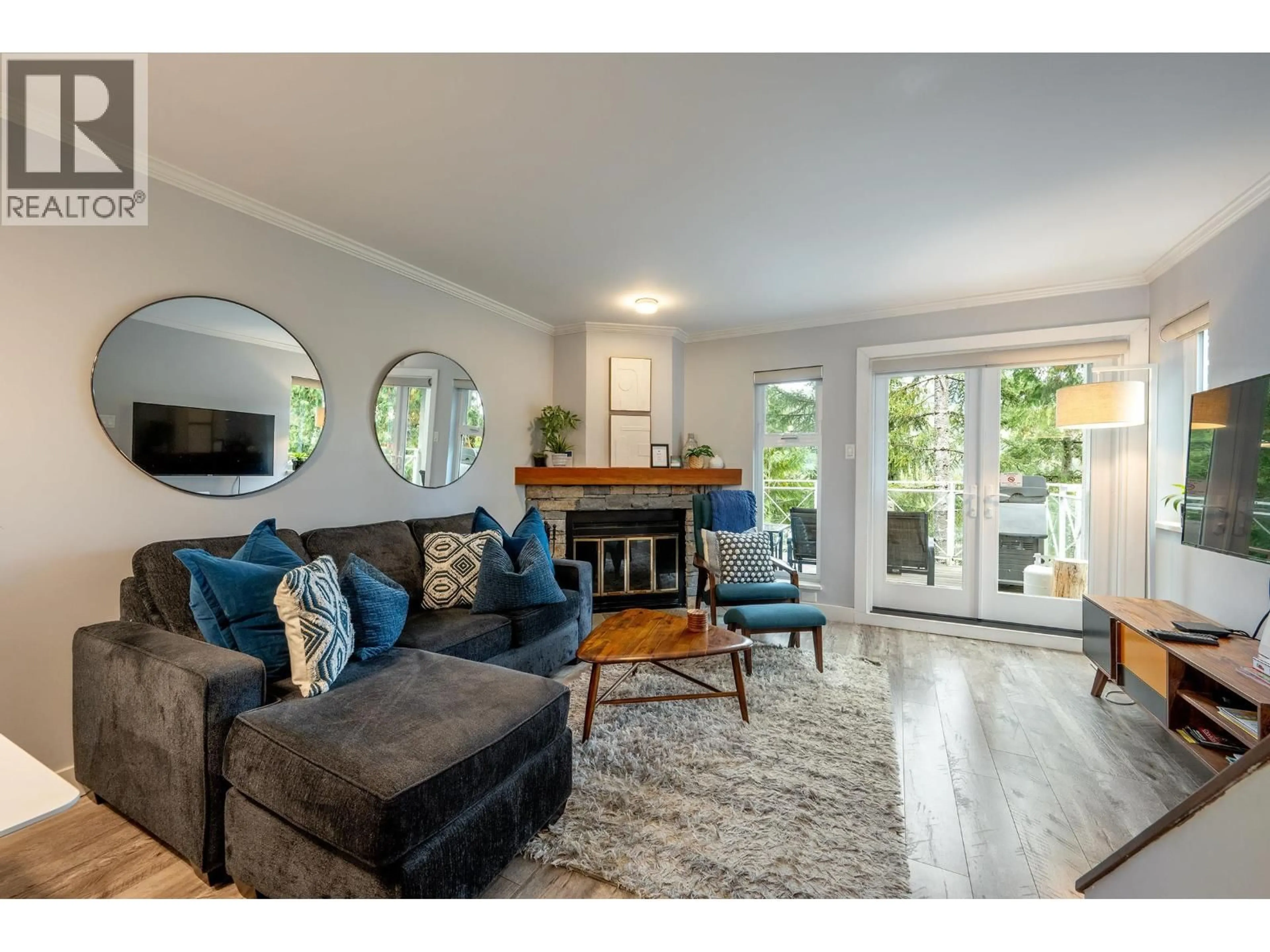 Living room with furniture, wood/laminate floor for 10 - 2211 MARMOT PLACE, Whistler British Columbia V8E0M6