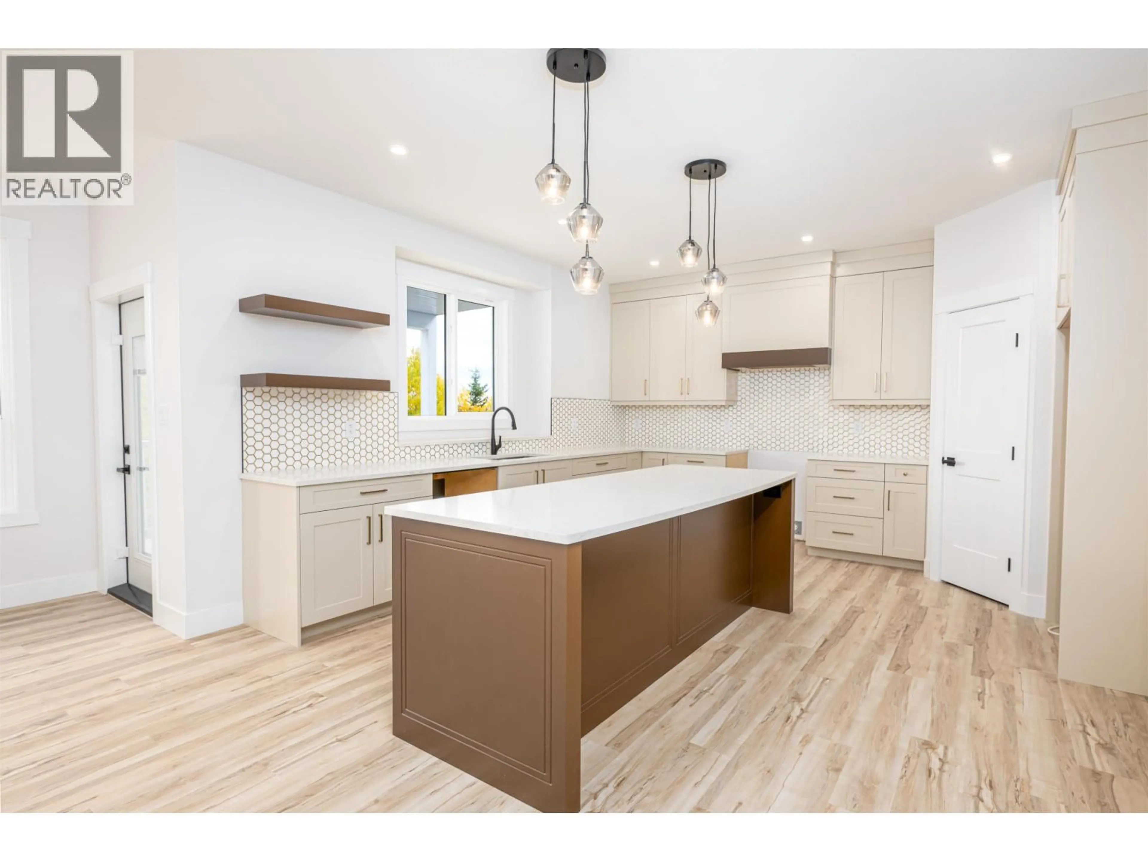 Open concept kitchen, wood/laminate floor for 1133 MONTEITH COURT, Prince George British Columbia V2N0G8