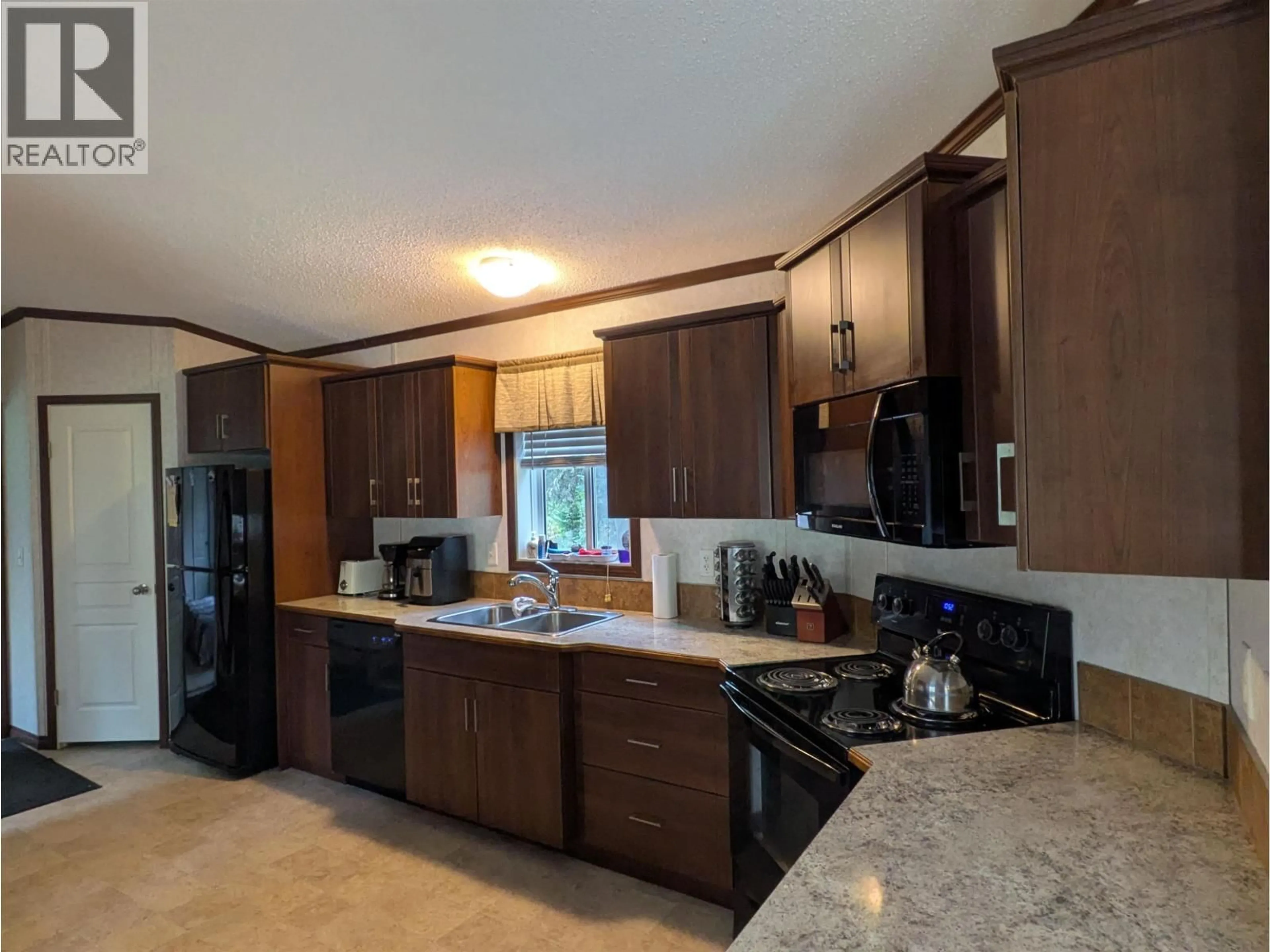 Open concept kitchen, ceramic/tile floor for 4905 BETHAM ROAD, Prince George British Columbia V2K2T6