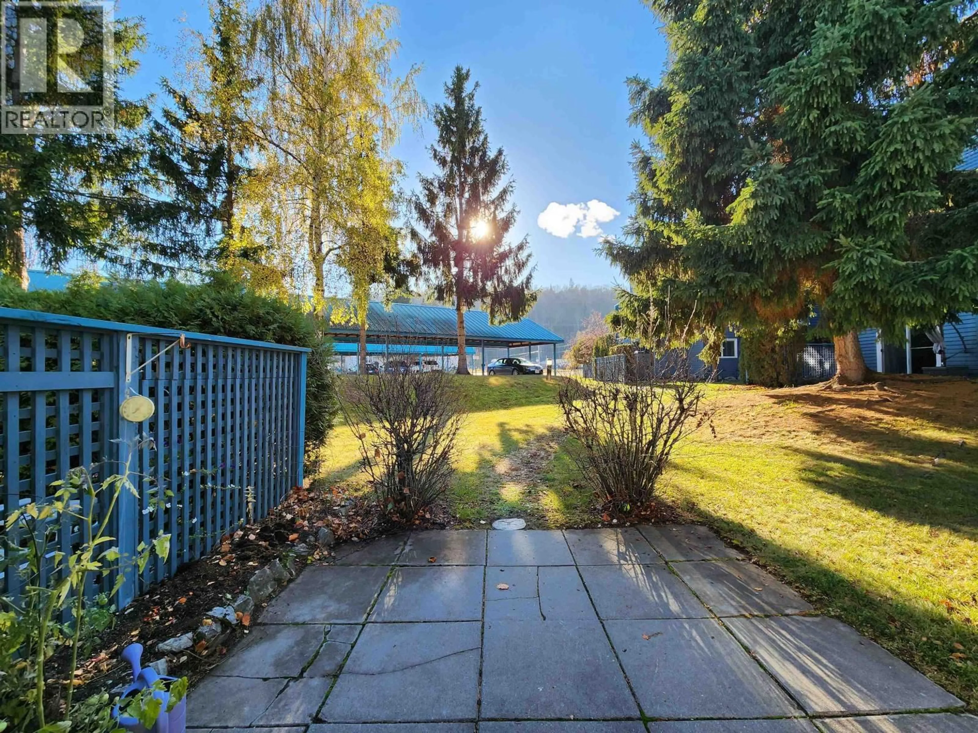 A pic from outside/outdoor area/front of a property/back of a property/a pic from drone, water/lake/river/ocean view for 102 - 3033 OSPIKA BOULEVARD, Prince George British Columbia V2N4L5