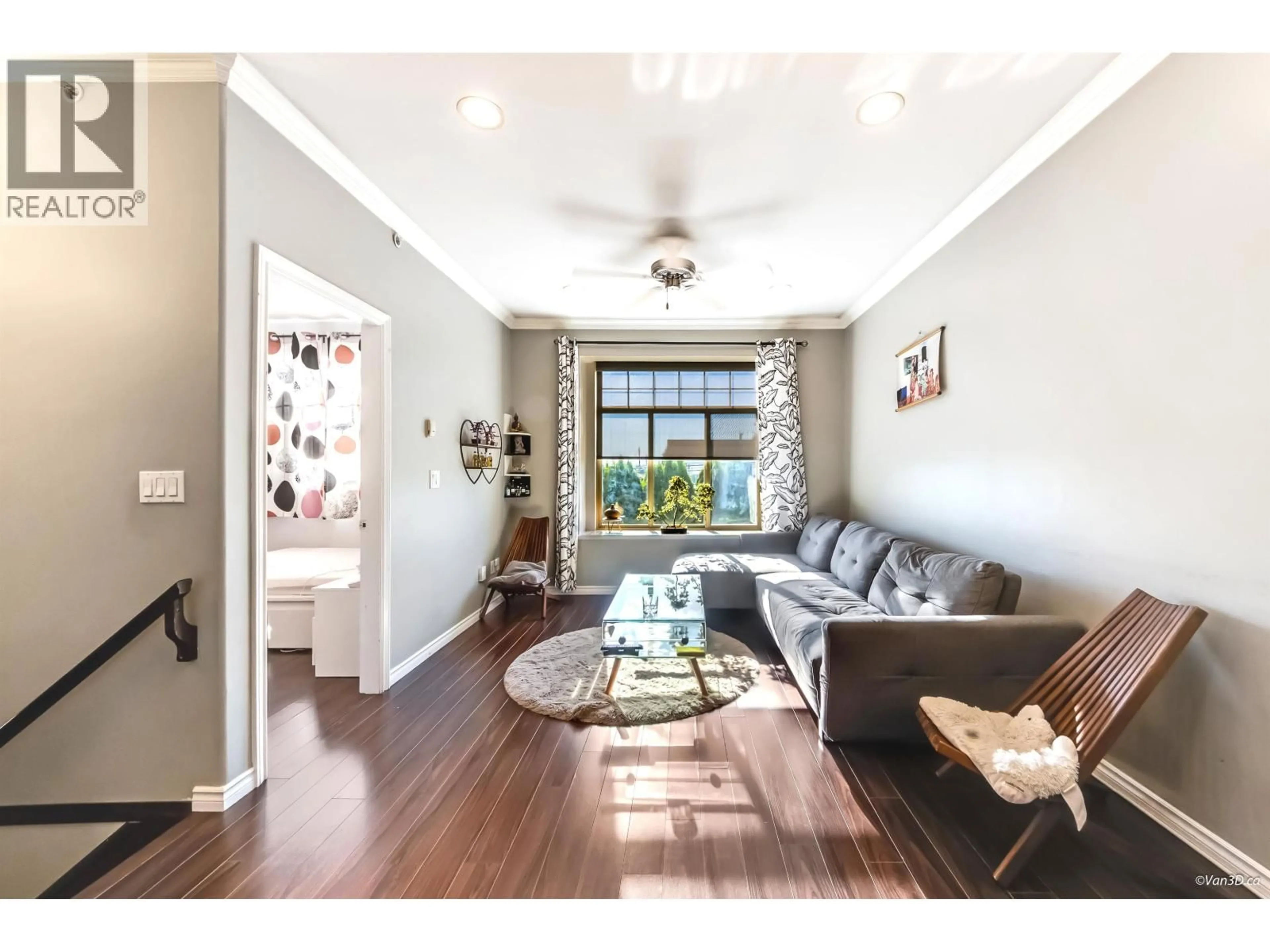 Living room with furniture, wood/laminate floor for 7778 MAIN STREET, Vancouver British Columbia V5X3K5