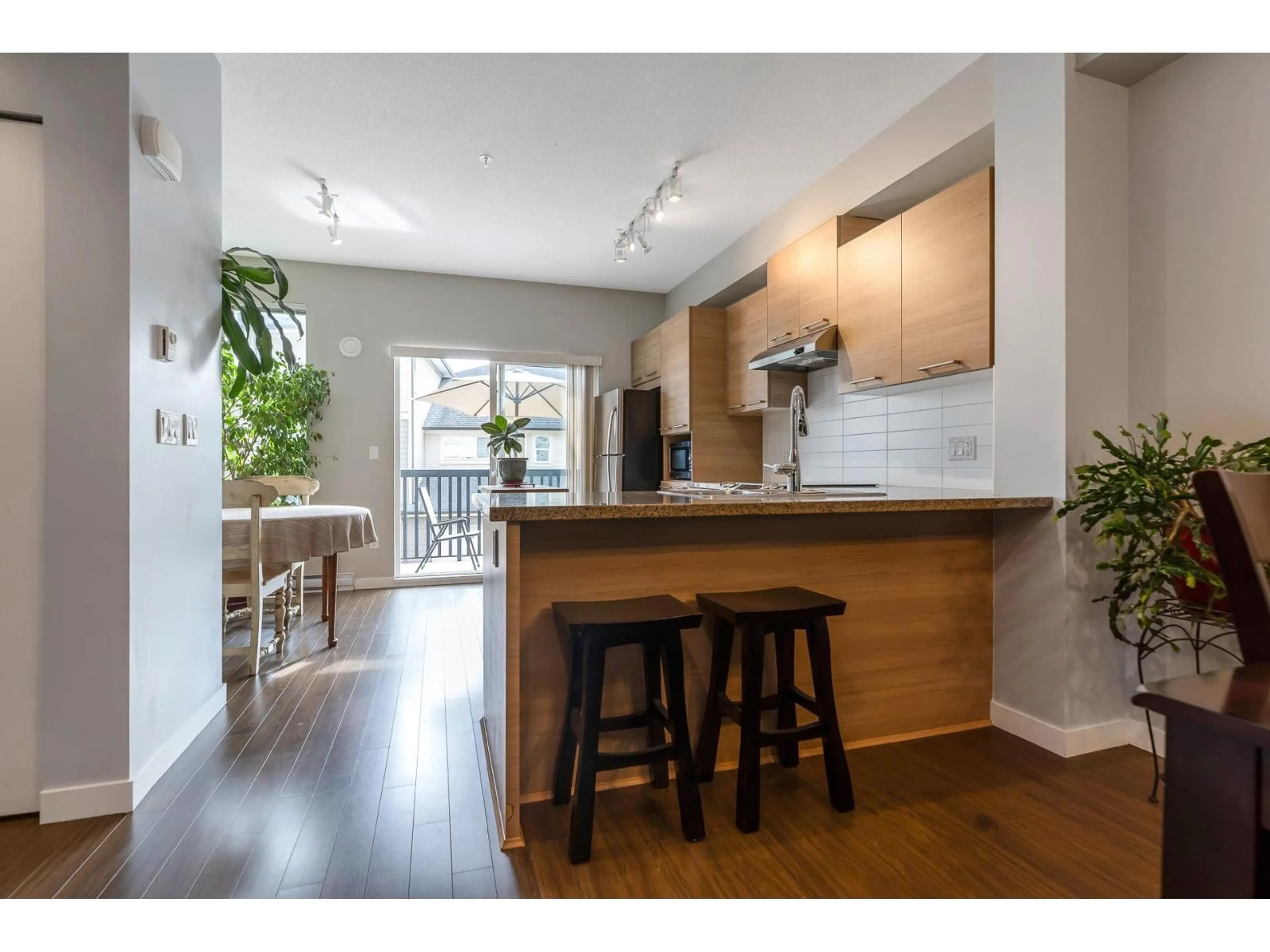 Open concept kitchen, wood/laminate floor for 26 - 7938 209TH, Langley British Columbia V2K0Y1