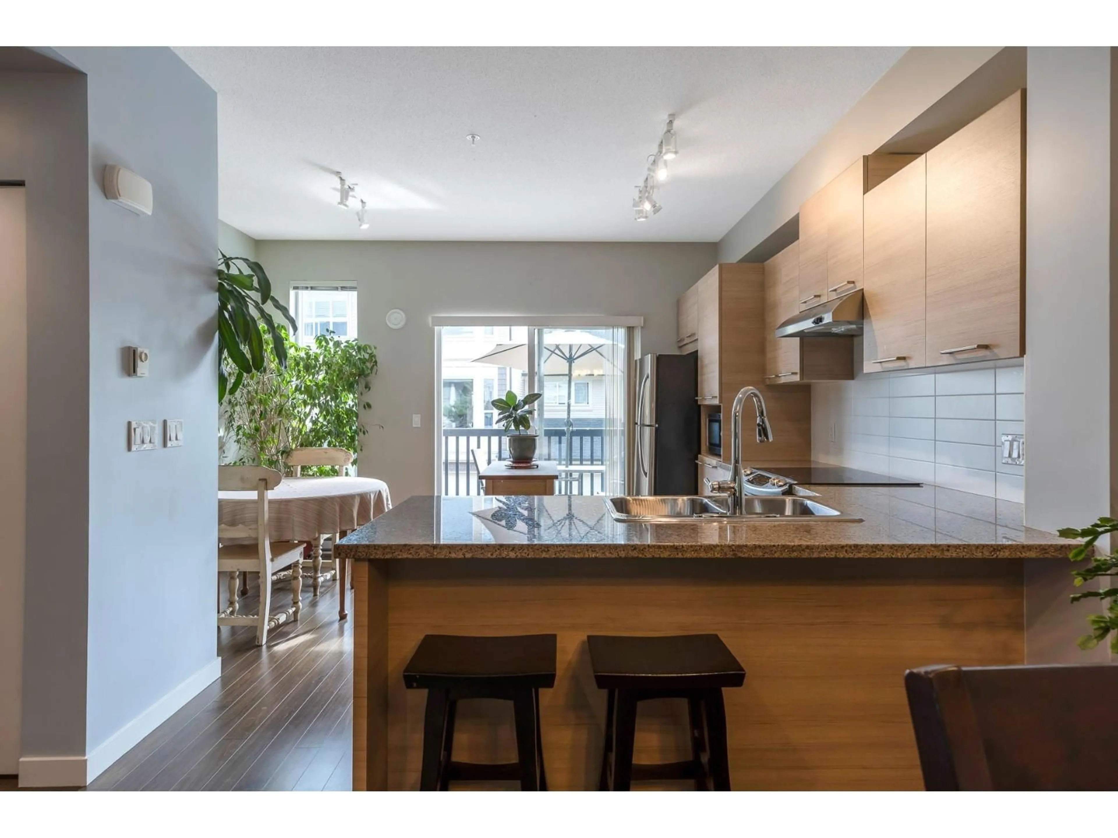 Open concept kitchen, wood/laminate floor for 26 - 7938 209TH, Langley British Columbia V2K0Y1