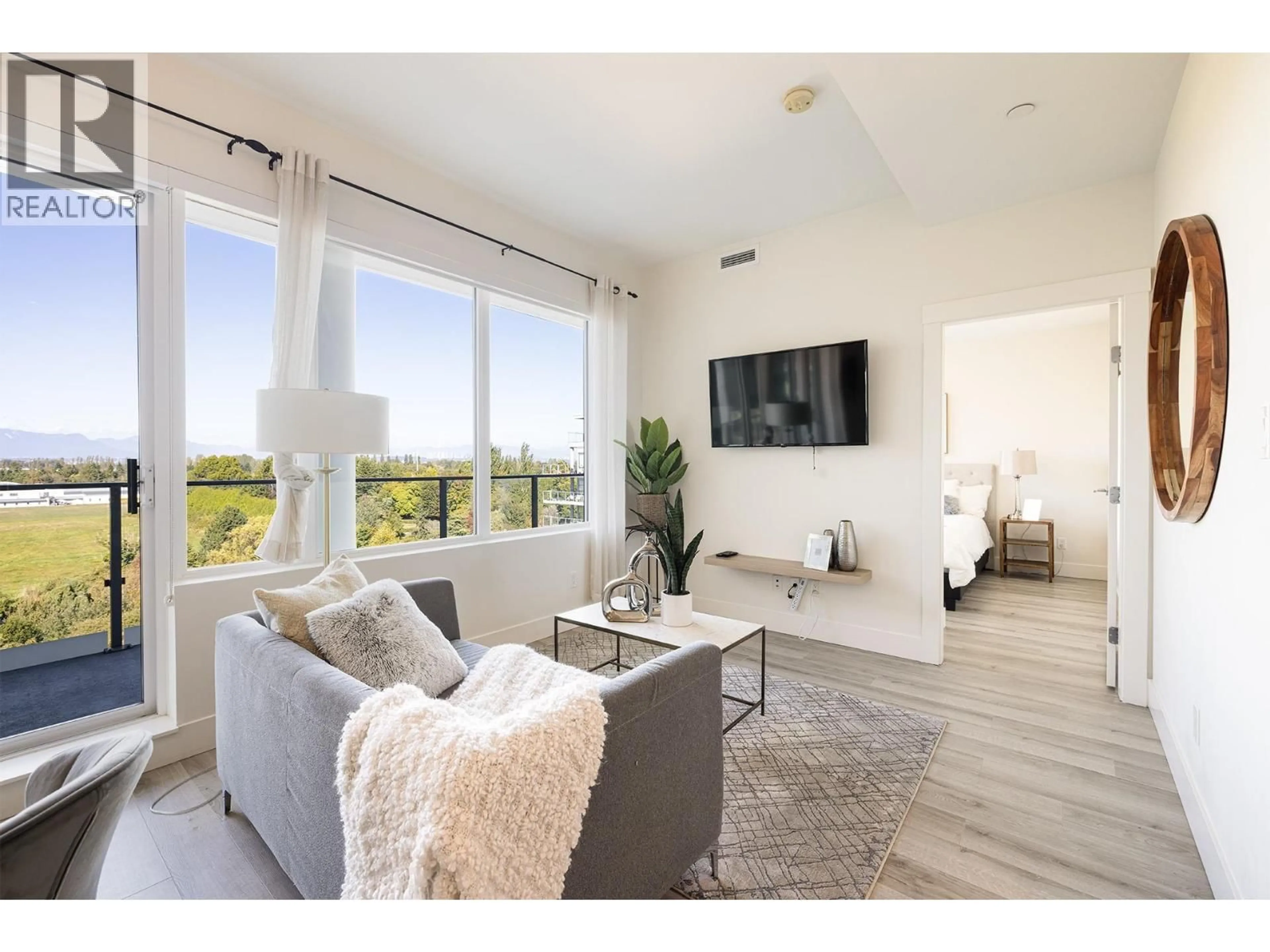 Living room with furniture, wood/laminate floor for 801 - 10780 NO. 5 ROAD, Richmond British Columbia V6W0B8