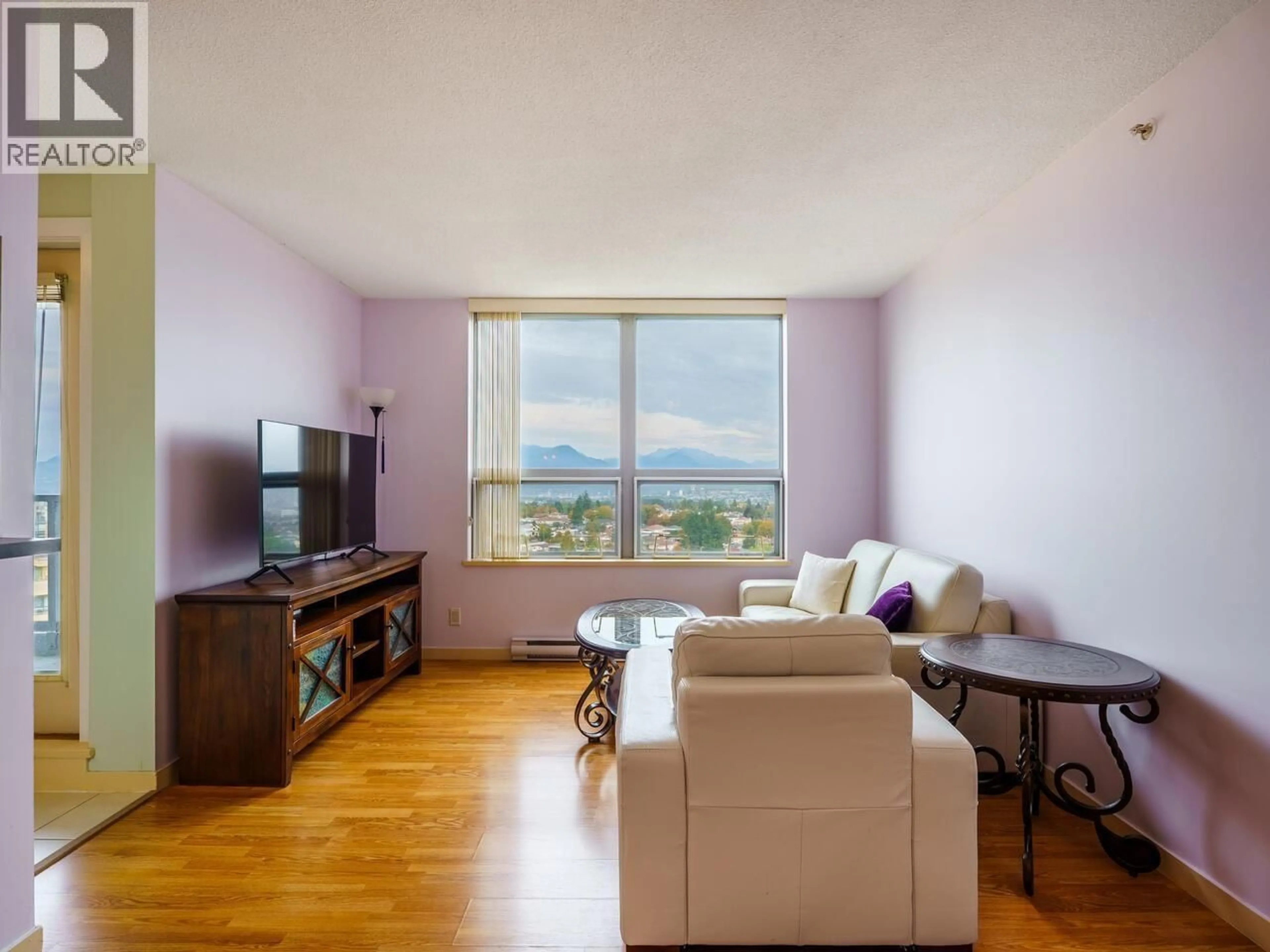 Living room with furniture, wood/laminate floor for 2409 - 3663 CROWLEY DRIVE, Vancouver British Columbia V5R6H4