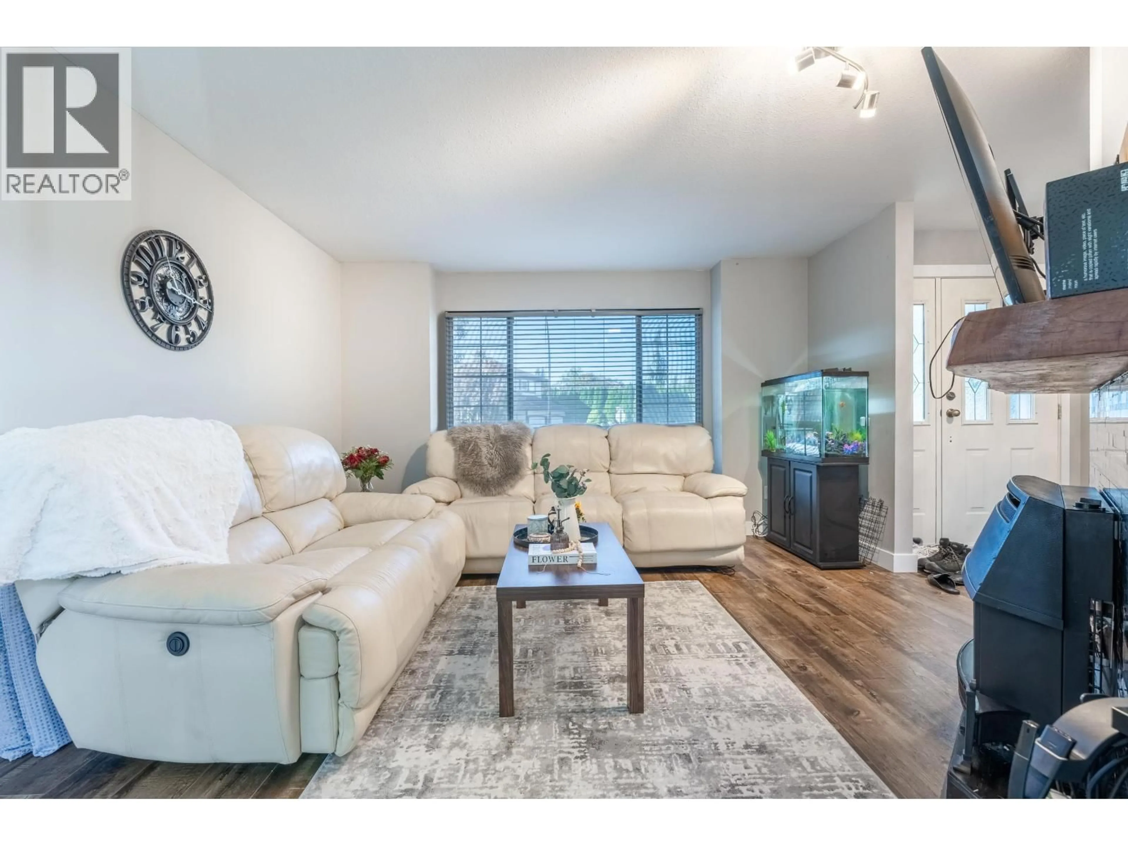 Living room with furniture, wood/laminate floor for 12492 205 STREET, Maple Ridge British Columbia V3X0A9