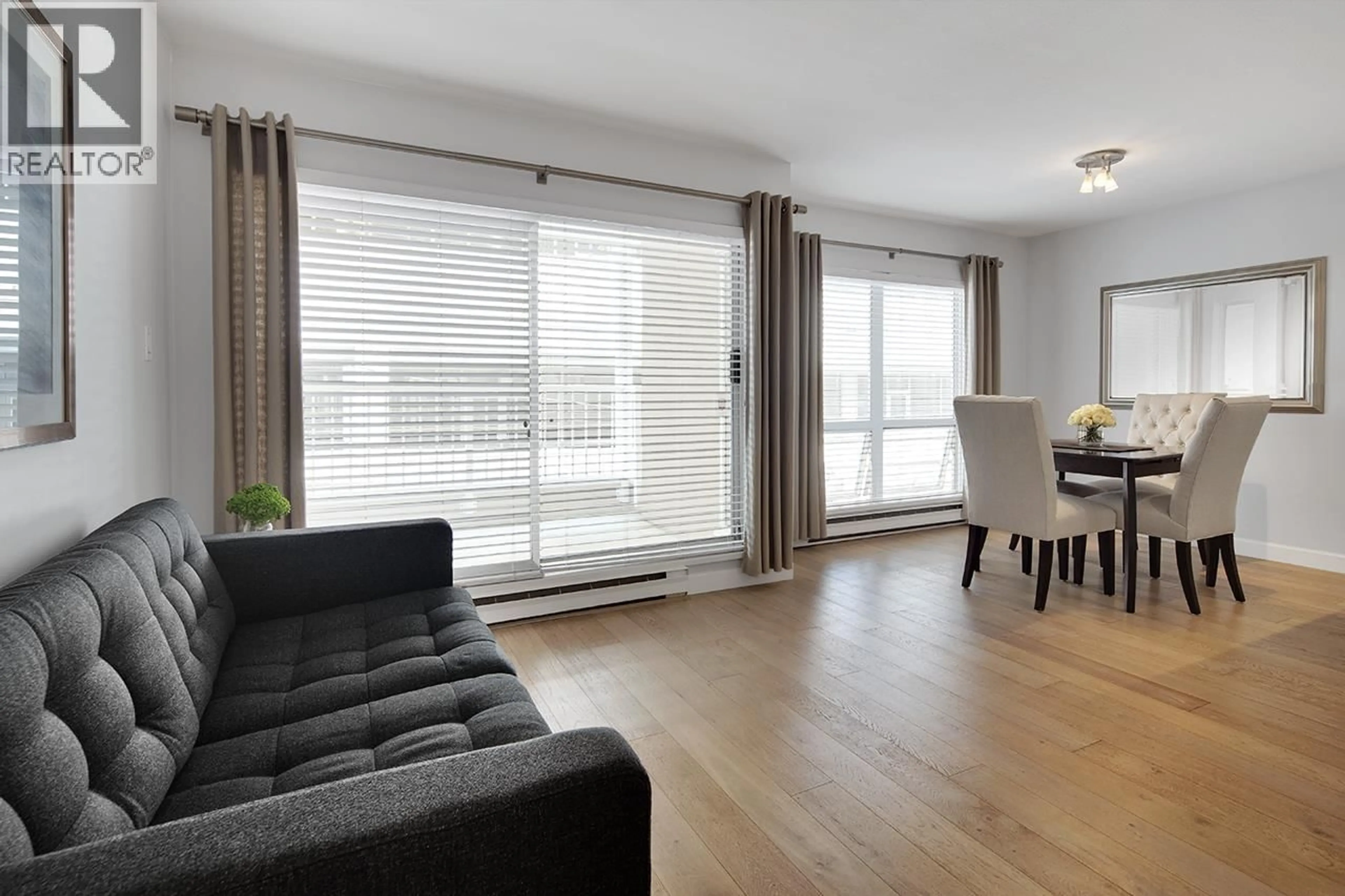 Living room with furniture, wood/laminate floor for 203 - 985 10TH AVENUE, Vancouver British Columbia V5Z1L9