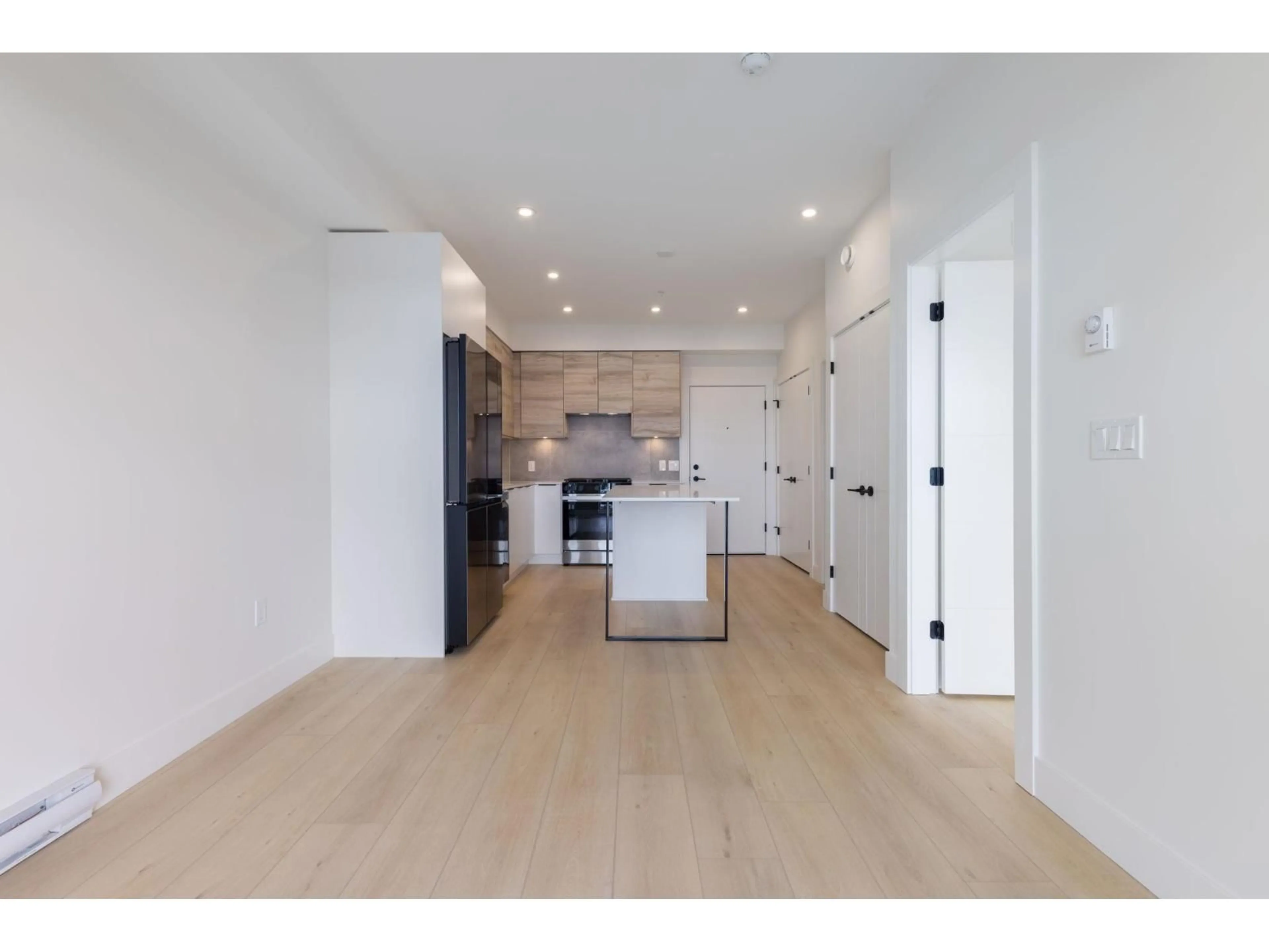 Open concept kitchen, wood/laminate floor for 210 - 30490 CARDINAL, Abbotsford British Columbia V2T0C5