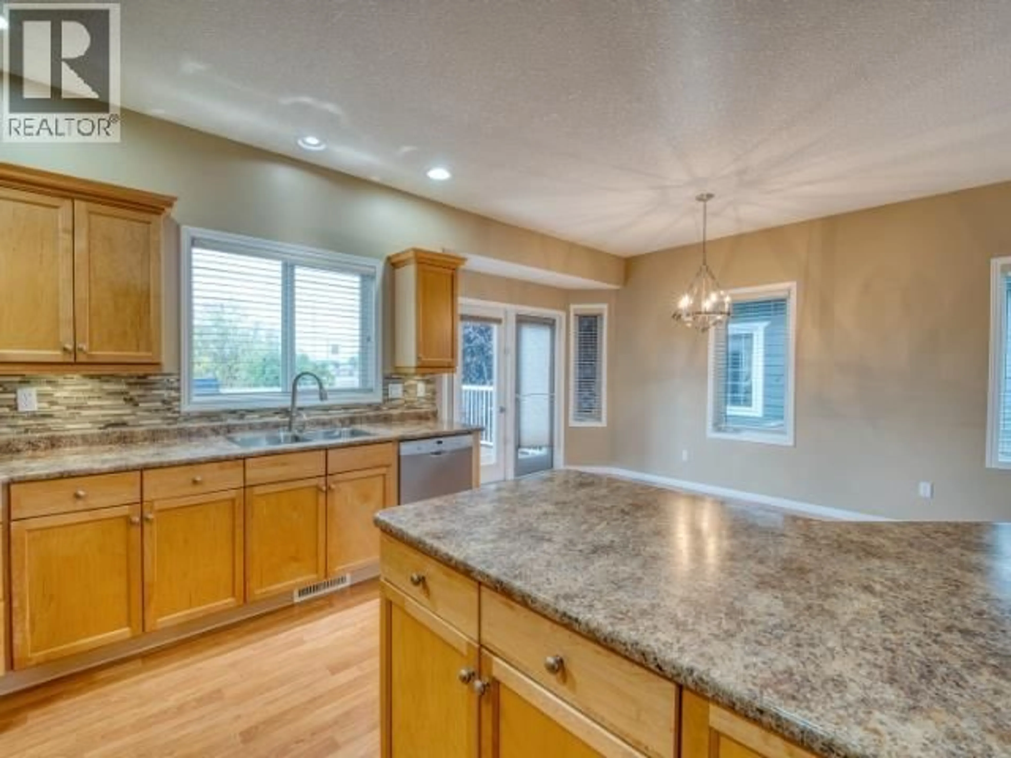 Open concept kitchen, unknown for 8703 109 AVENUE, Fort St. John British Columbia V1J7E6