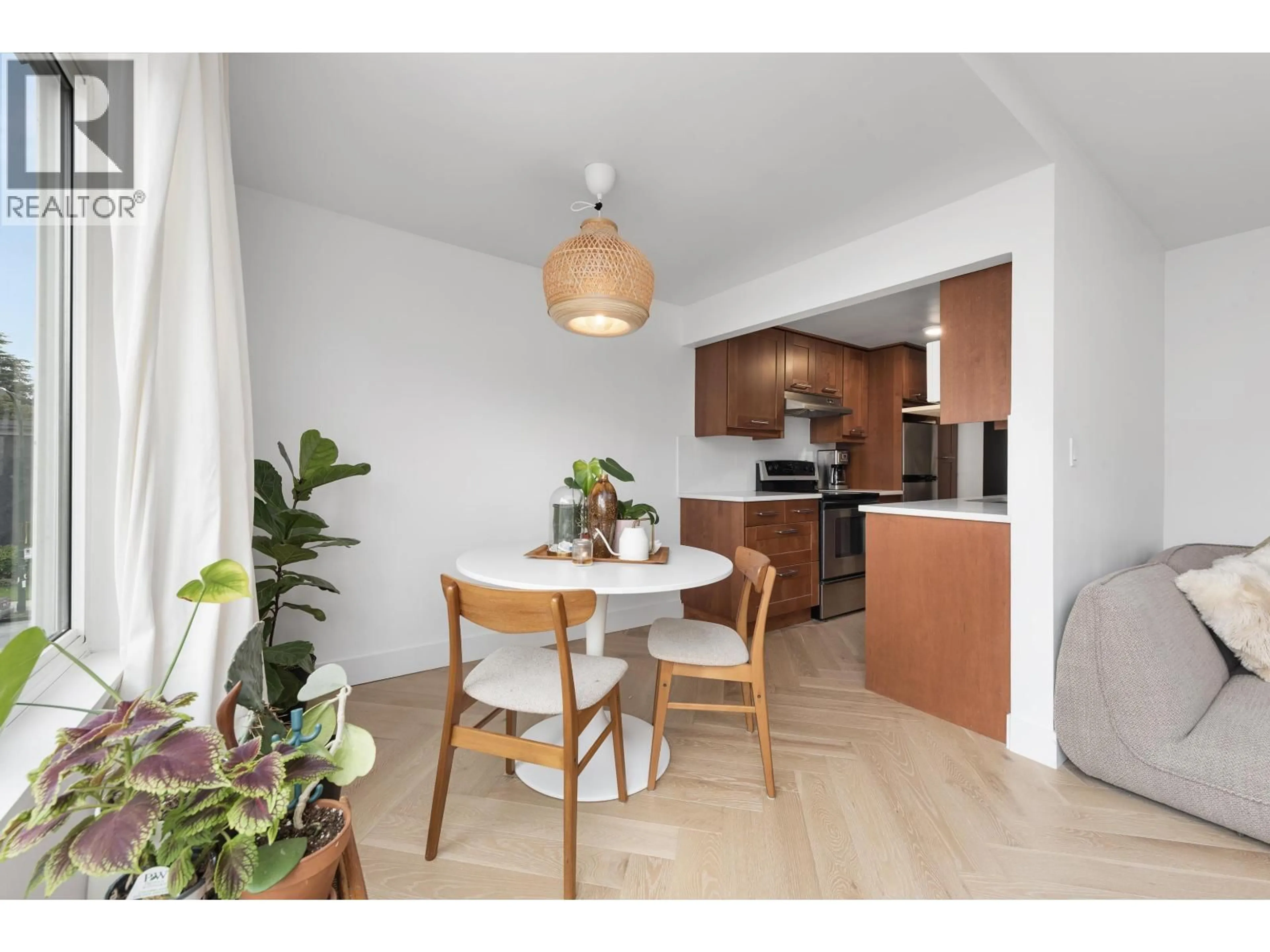 Open concept kitchen, wood/laminate floor for 34 - 1480 ARBUTUS STREET, Vancouver British Columbia V6J3W8