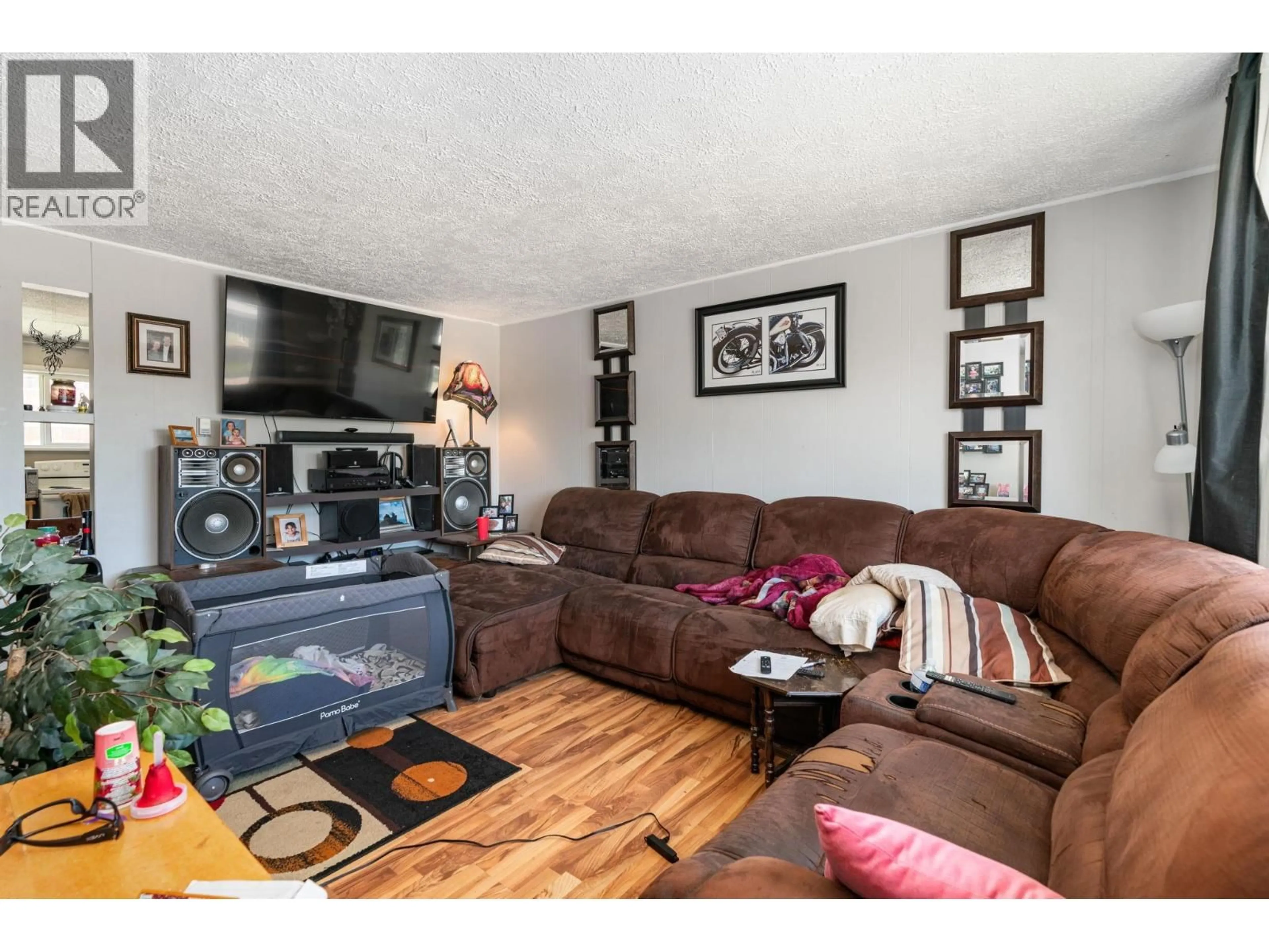Living room with furniture, wood/laminate floor for 1807 9TH AVENUE, Prince George British Columbia V2M1N2