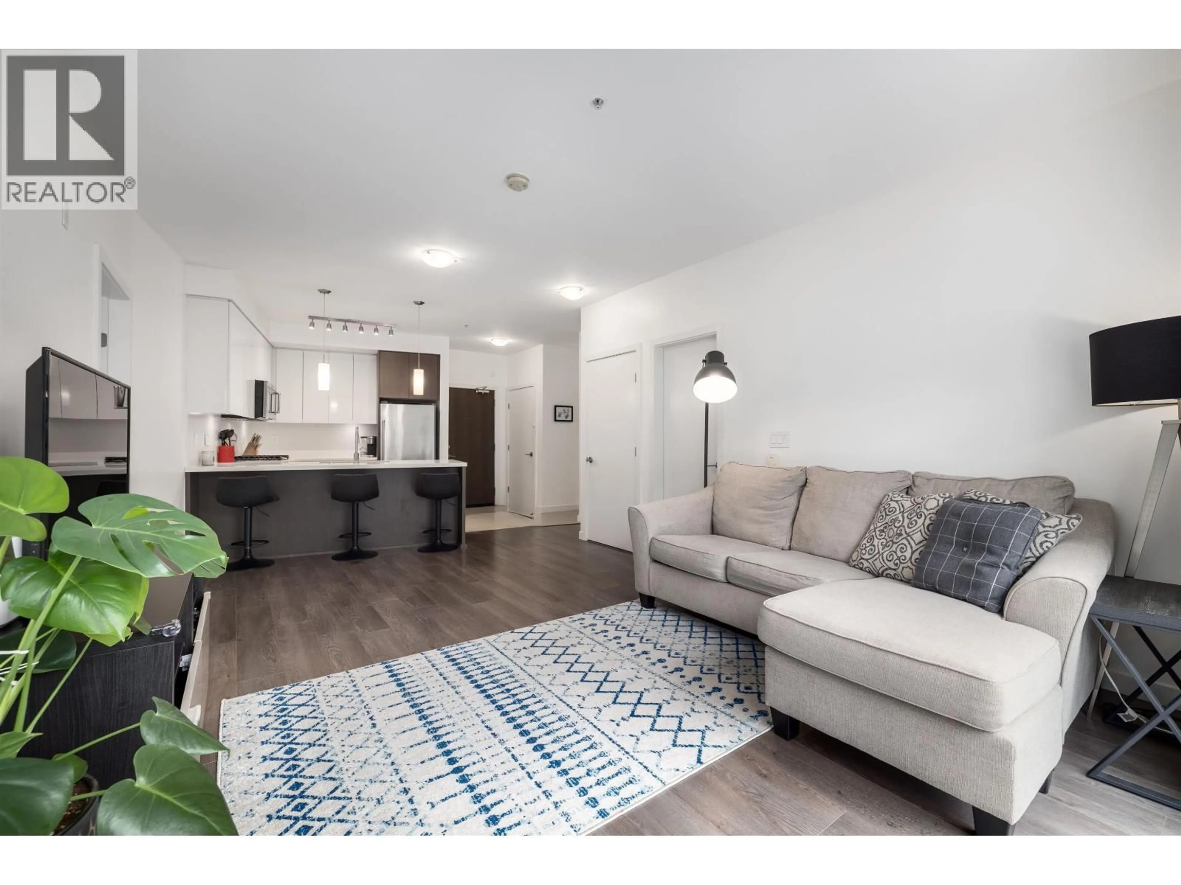 Living room with furniture, wood/laminate floor for 217 - 22 ROYAL AVENUE, New Westminster British Columbia V3L0H1