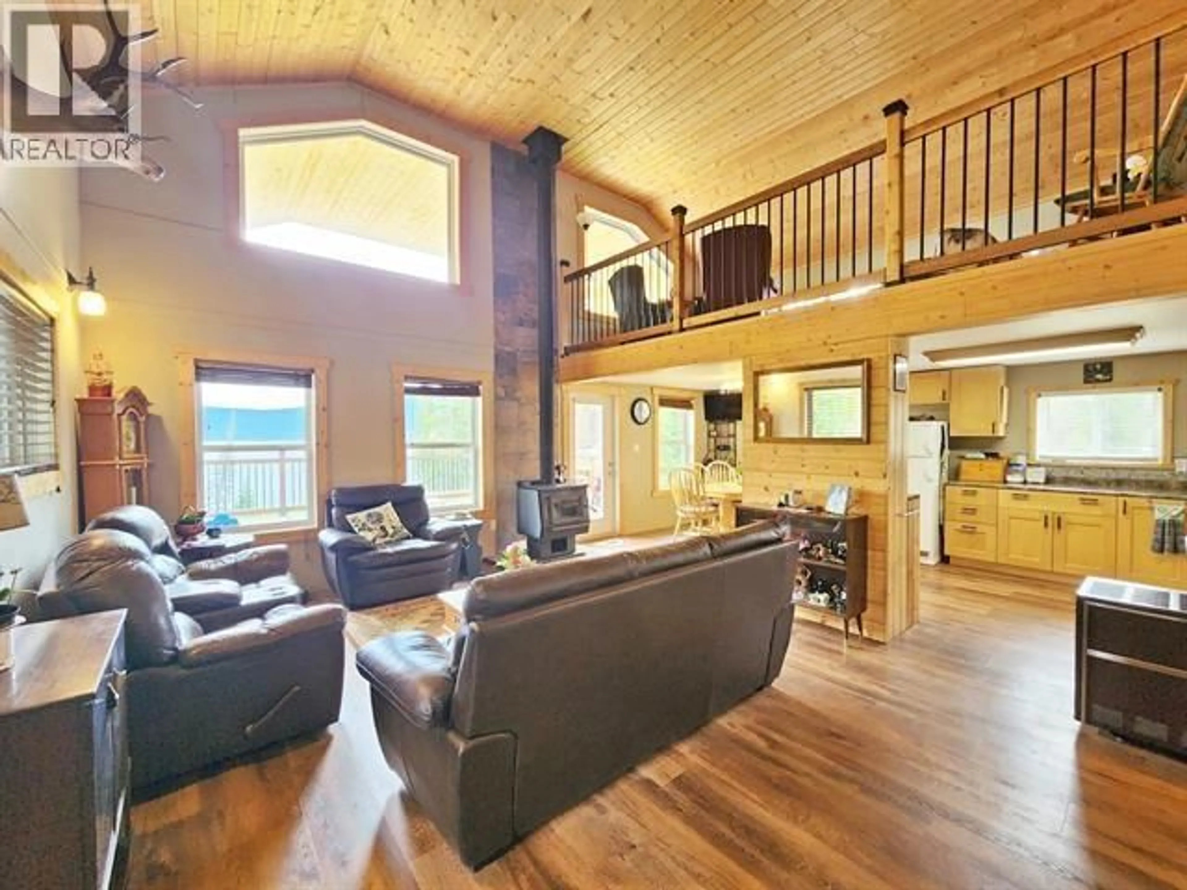 Living room with furniture, wood/laminate floor for 7132 BOWRON LAKE ROAD, Wells / Barkerville British Columbia V0K2R0