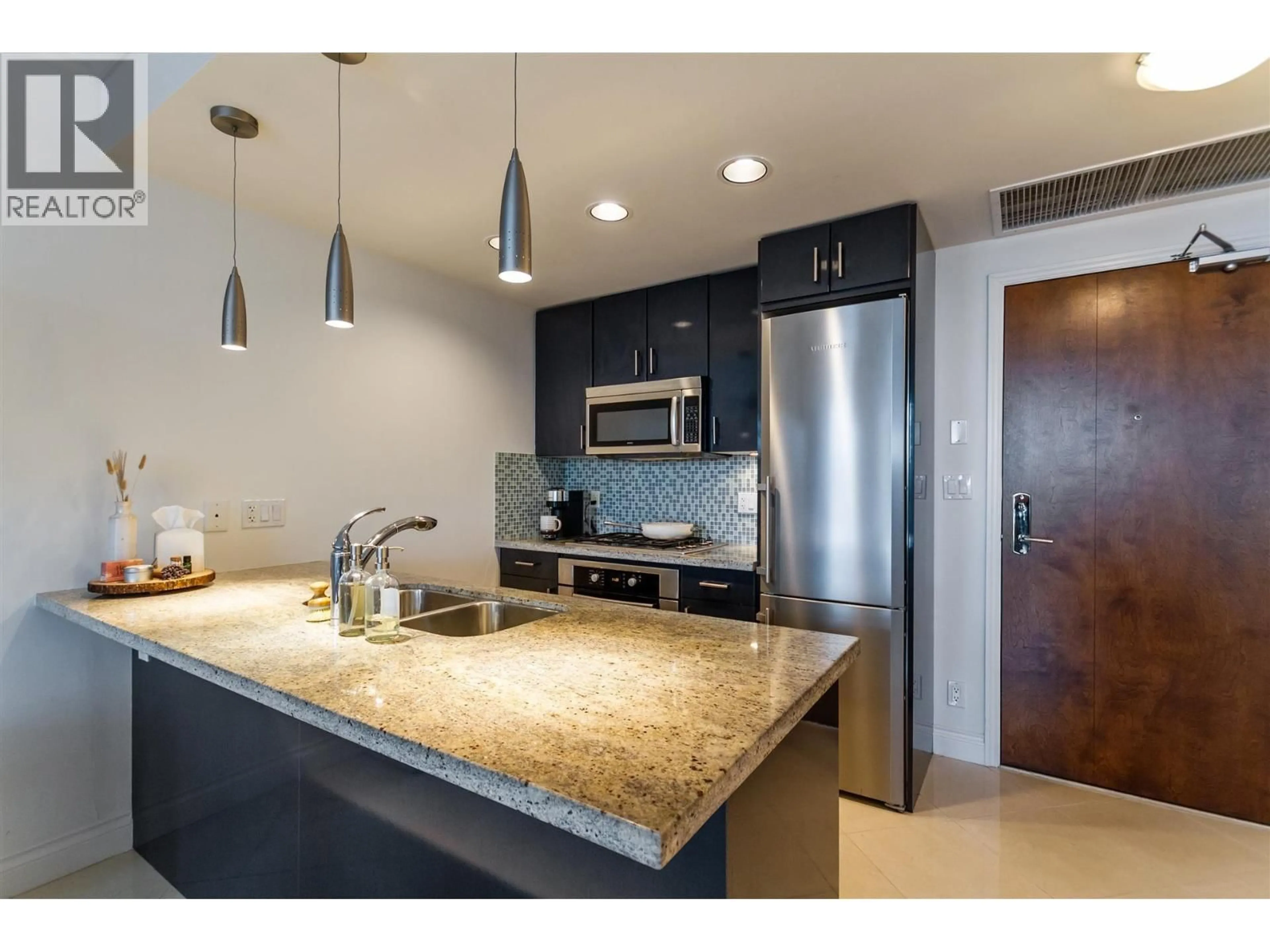 Open concept kitchen, unknown for 603 - 172 VICTORY SHIP WAY, North Vancouver British Columbia V7L0B5