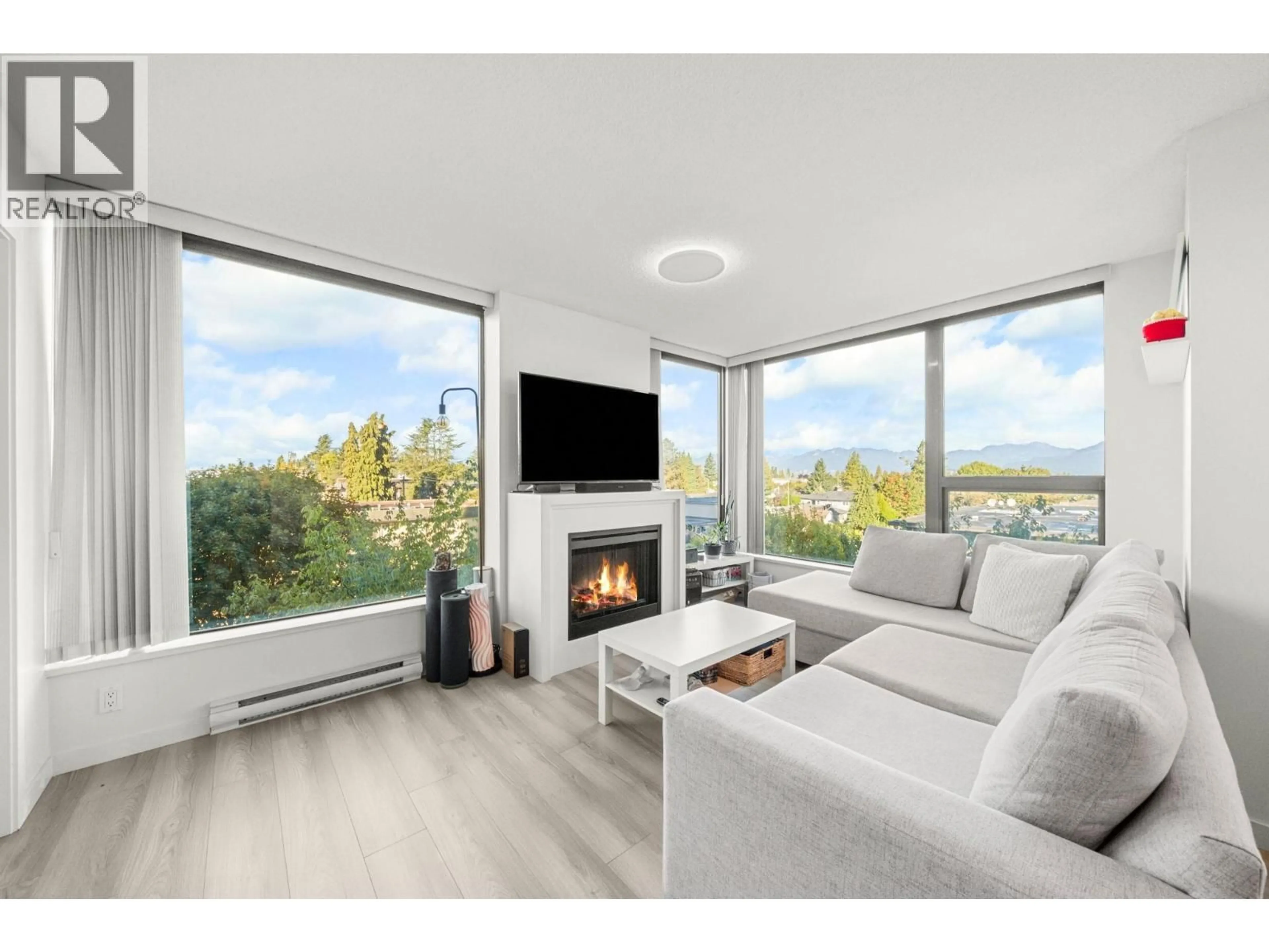 Living room with furniture, wood/laminate floor for 503 - 7108 COLLIER STREET, Burnaby British Columbia V5E0A1
